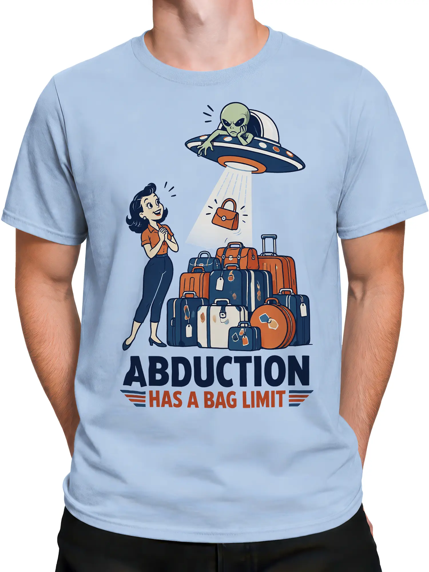 Male torso wearing a light blue alien abduction T-shirt with colorful luggage and a retro UFO design