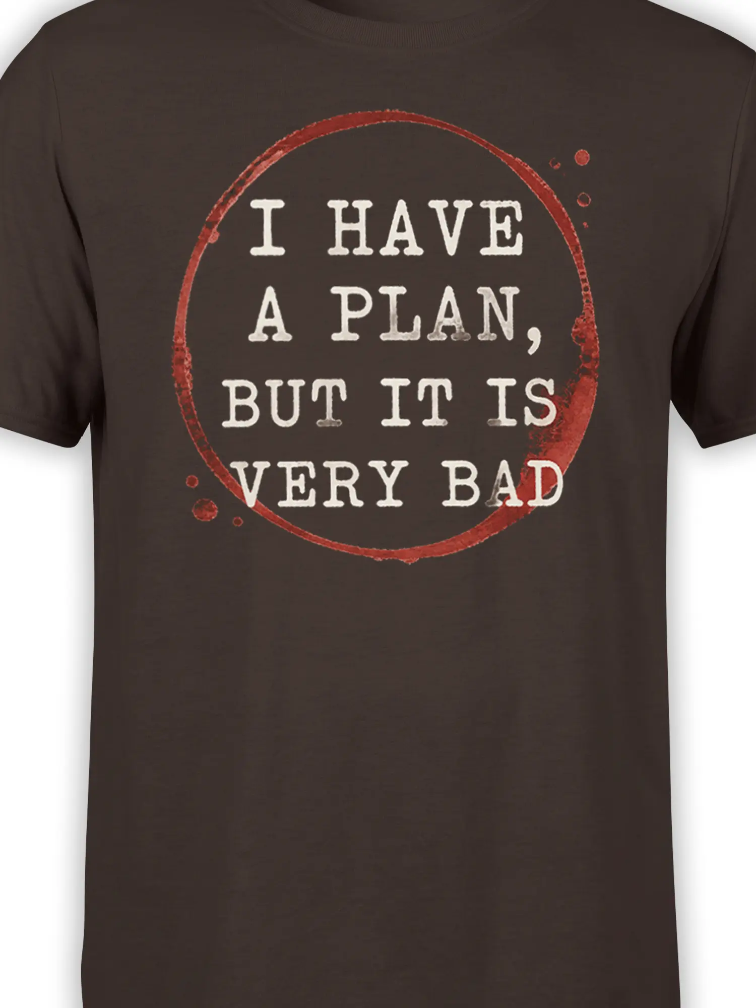 Close-up of brown T-shirt graphic with distressed red circle and cream bad plan slogan lettering
