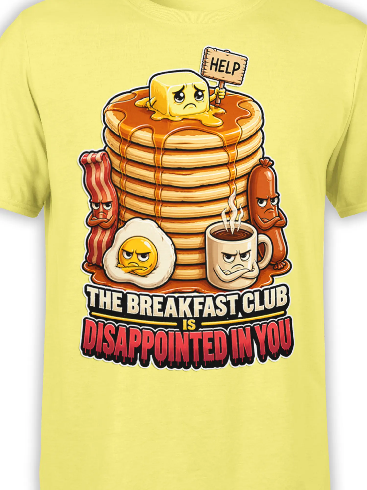Close-up of grumpy breakfast foods, syrupy pancakes, coffee, and bold sarcastic lettering on a yellow shirt