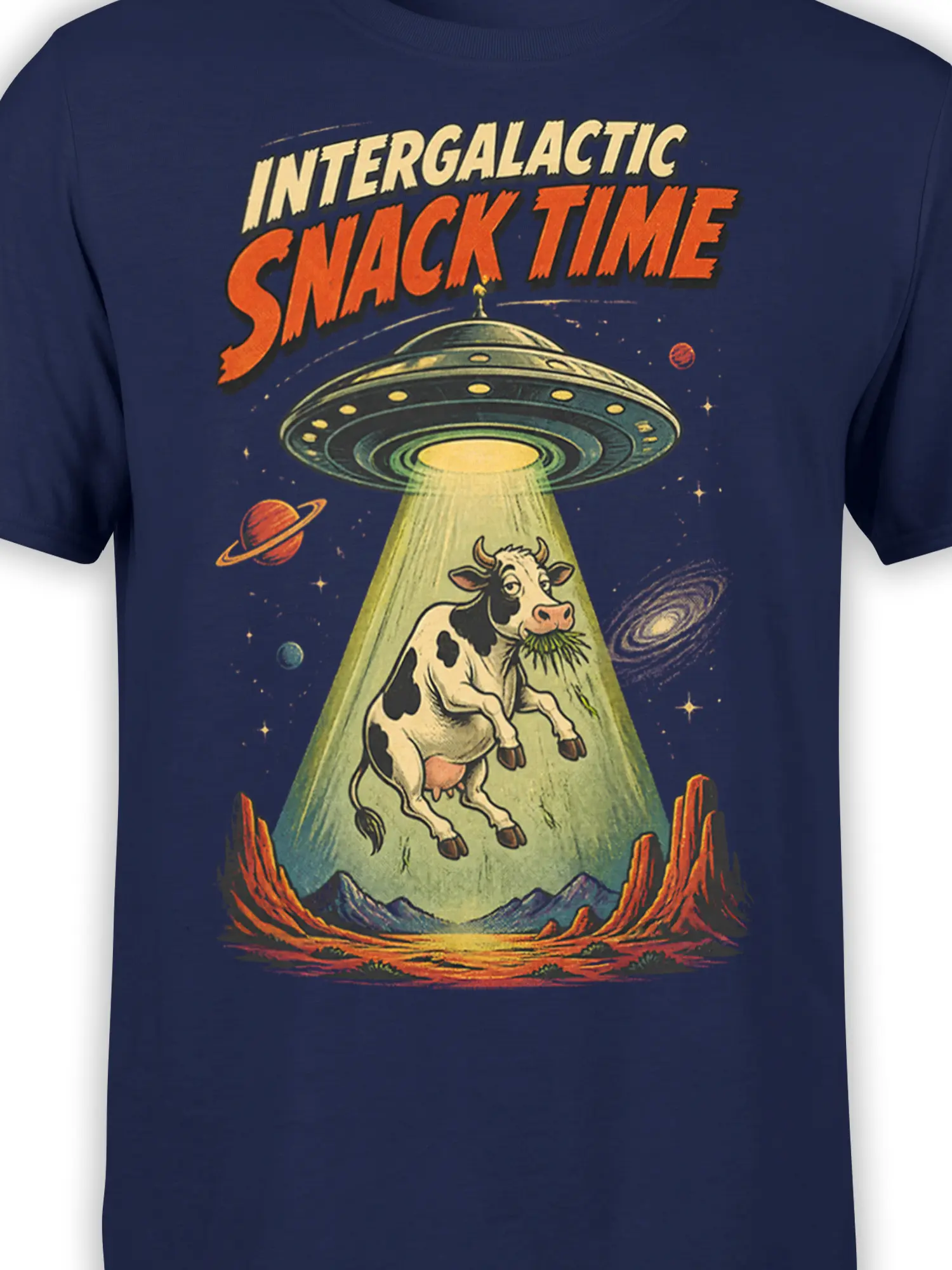 Close-up of UFO beaming a cow in a retro space scene on a navy graphic tee