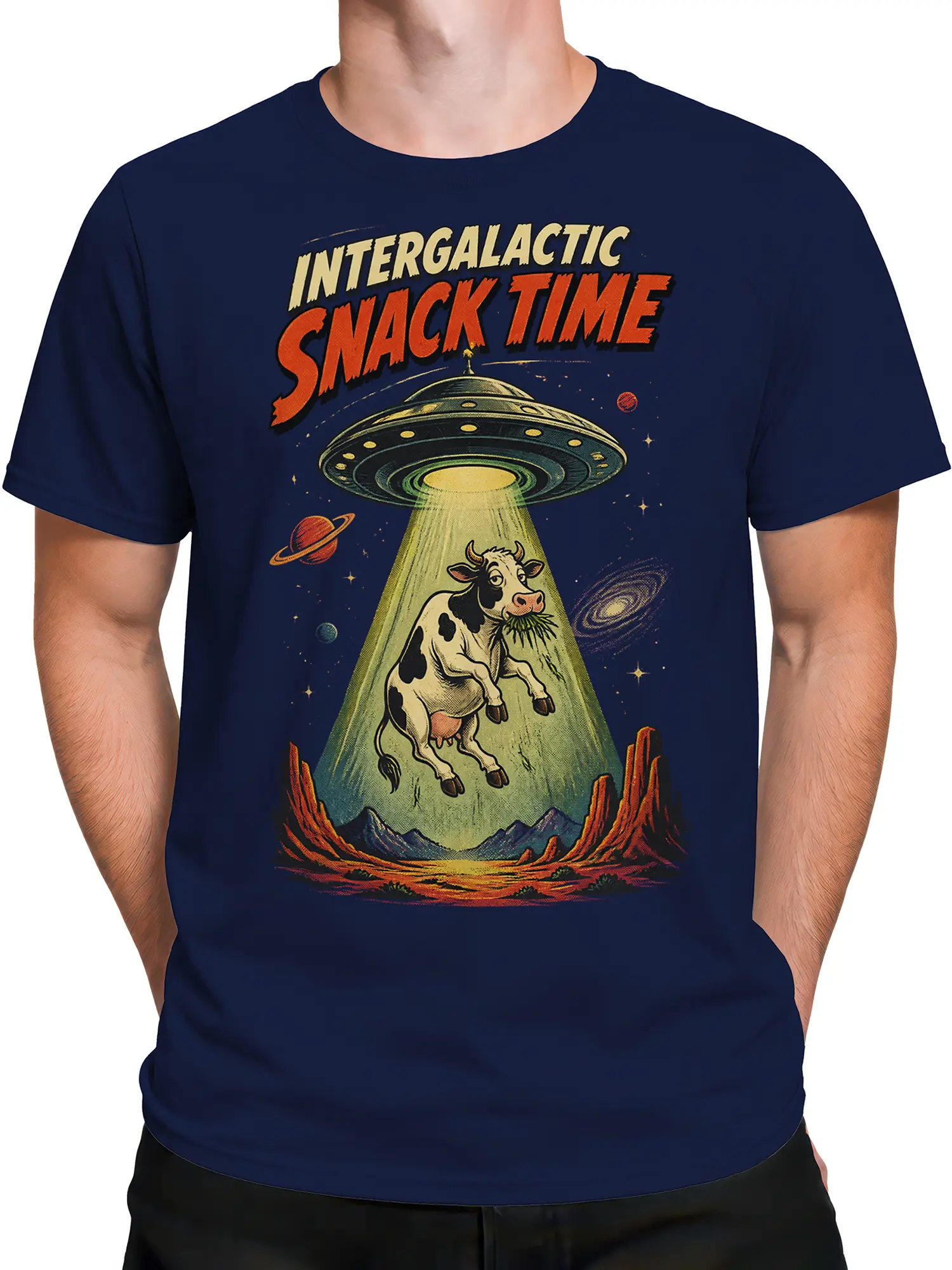 Male torso wearing a navy T-shirt with a retro UFO cow and space graphic
