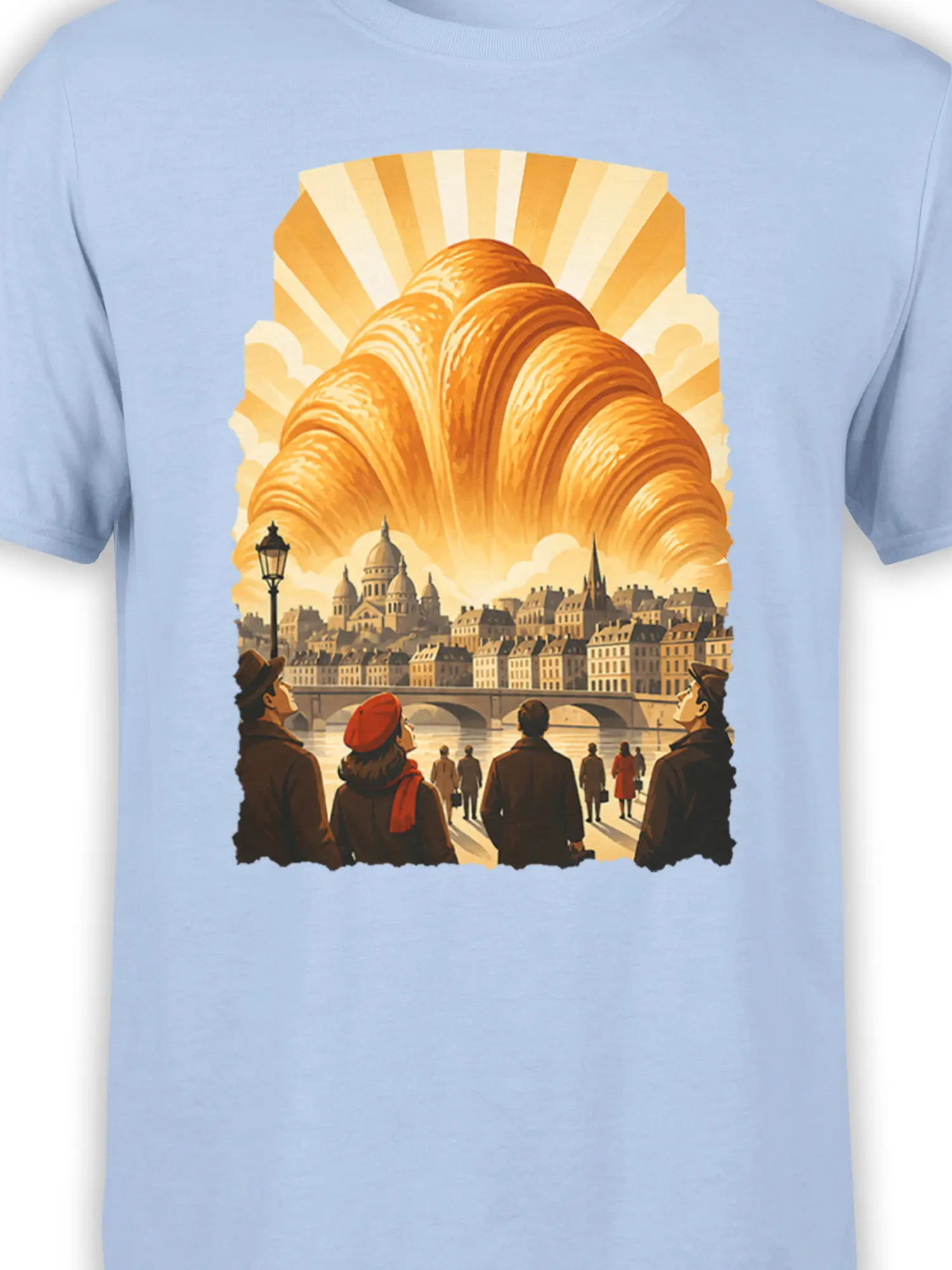 Close-up of the golden croissant and vintage city illustration printed on a light blue Paris graphic tee