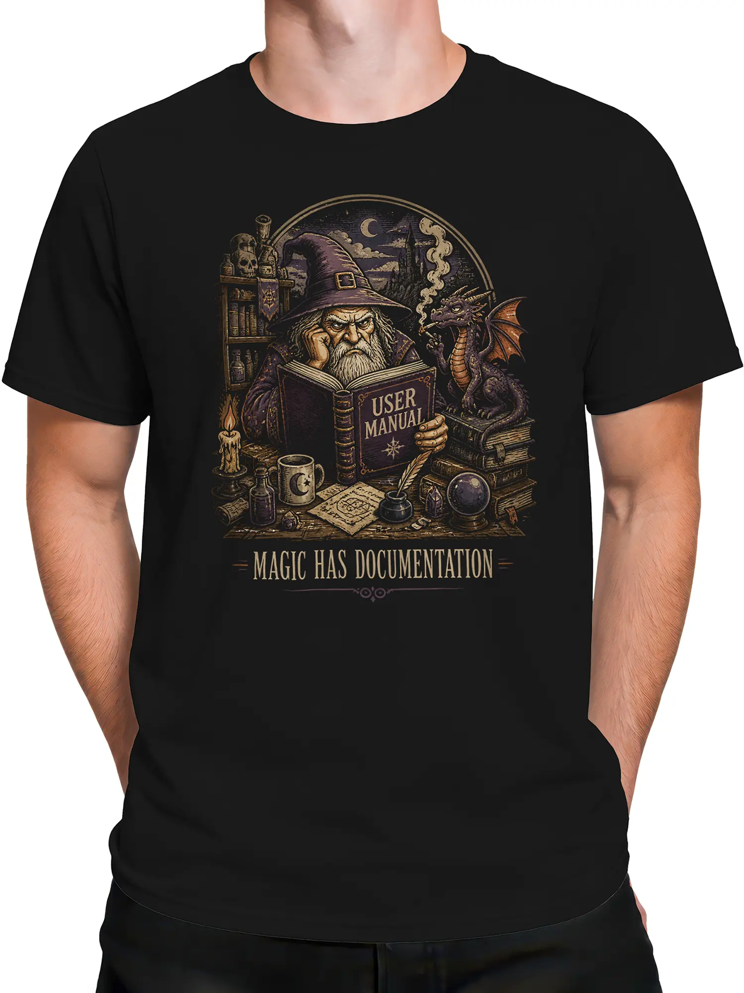 Male torso wearing a black fantasy T-shirt with wizard, dragon, and spellbook artwork
