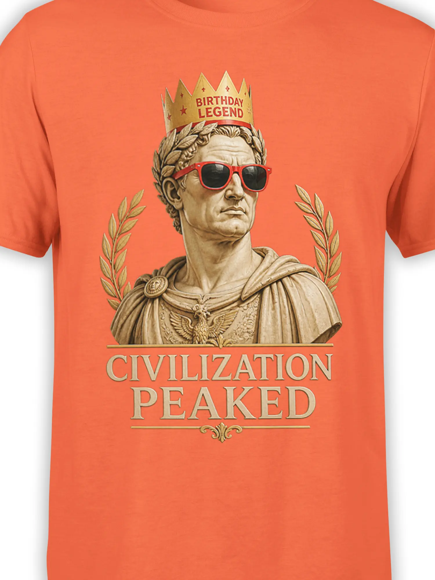 Close-up of crowned Roman bust with red sunglasses and birthday legend text on orange fabric