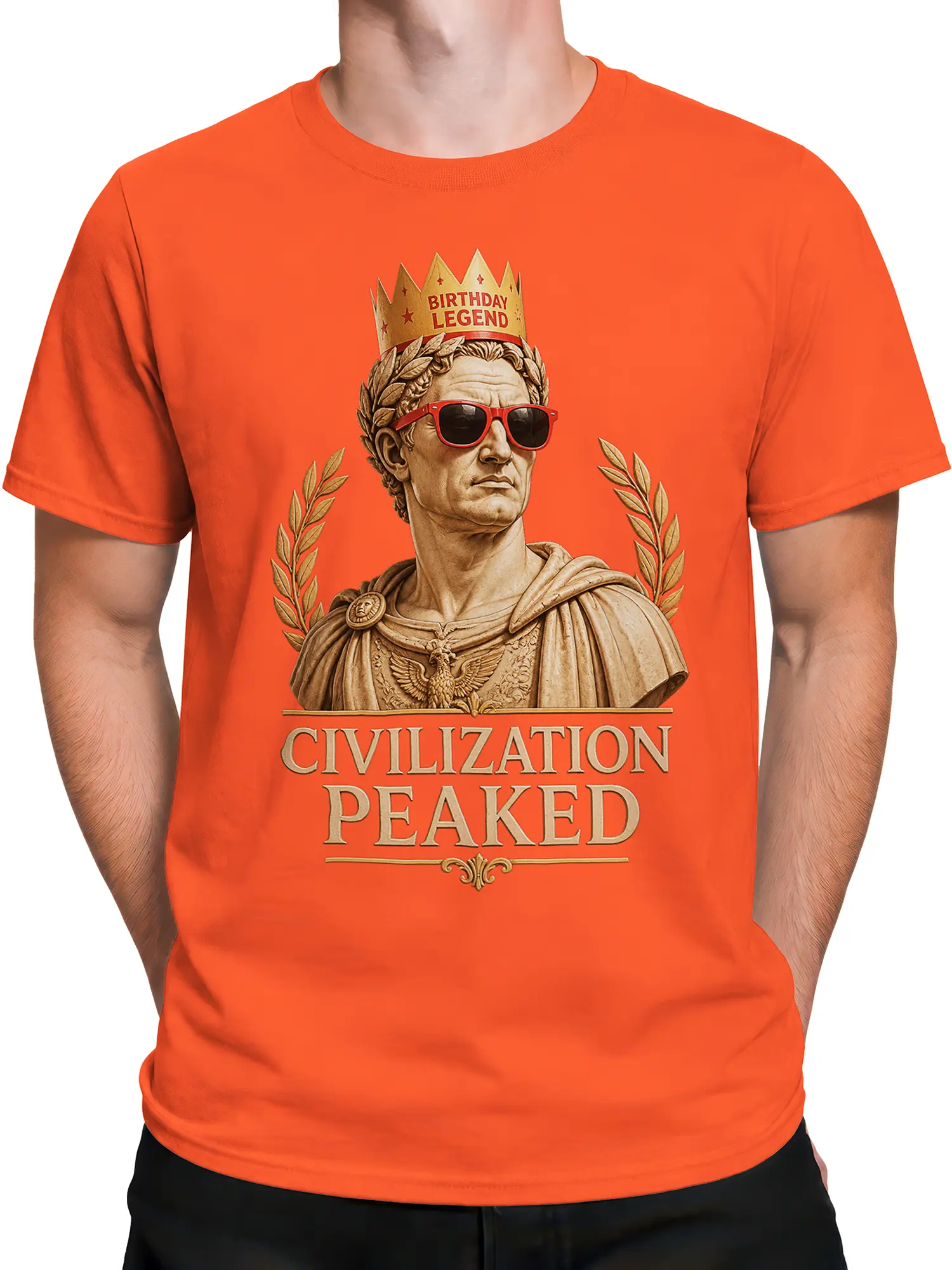 Male torso wearing orange T-shirt with Roman legend birthday graphic and civilization peaked lettering