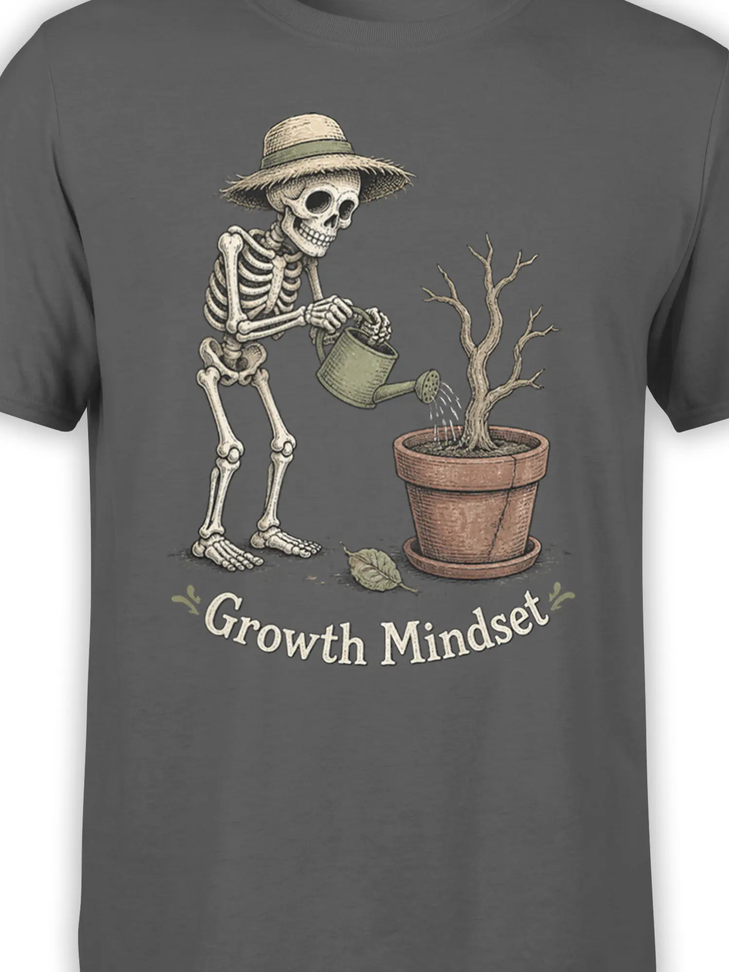 Close-up of the skeleton gardener and potted tree artwork on a gray growth mindset T-shirt