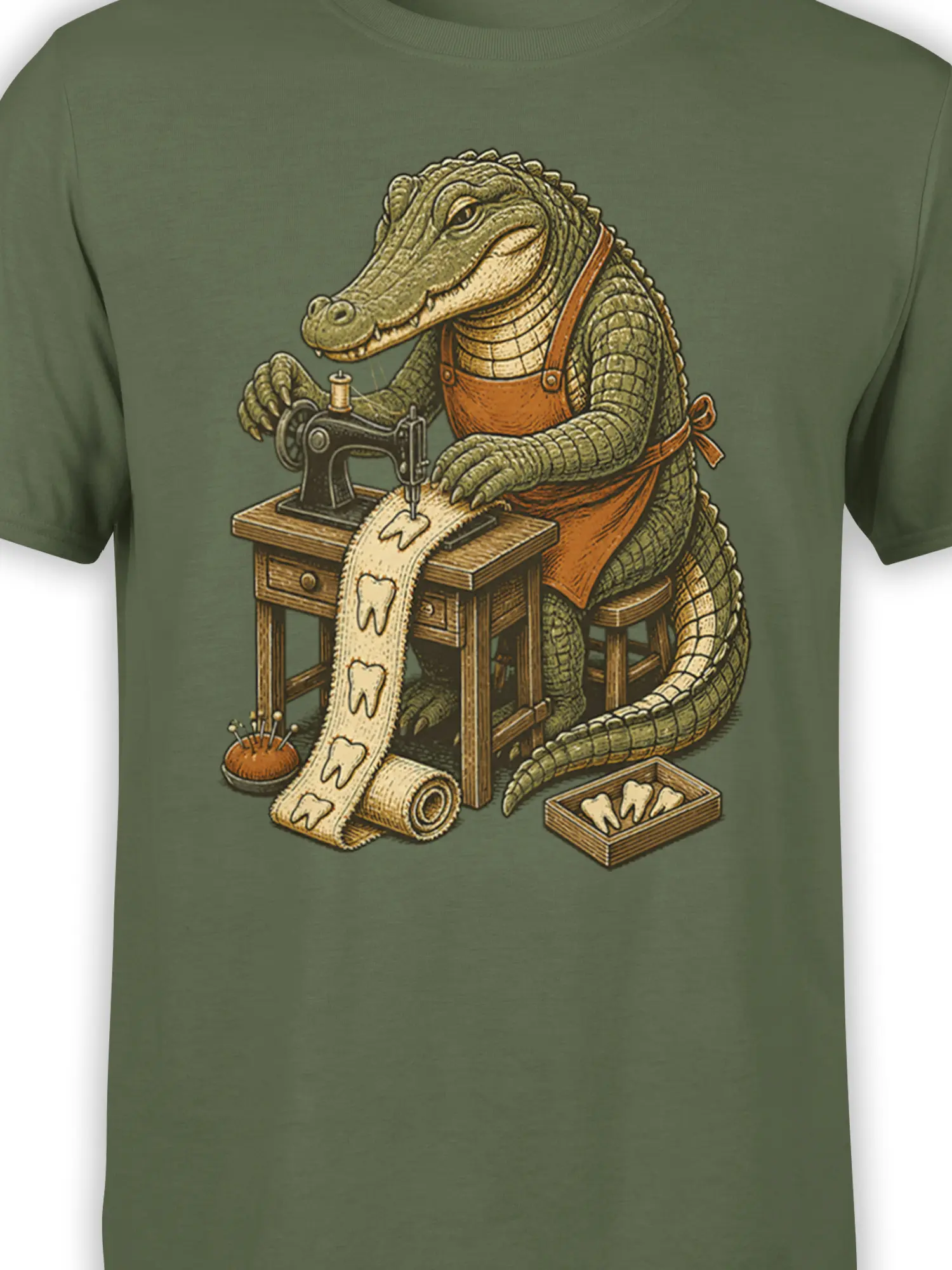 Close-up of crocodile tailor artwork on a green T-shirt with sewing machine and tooth details