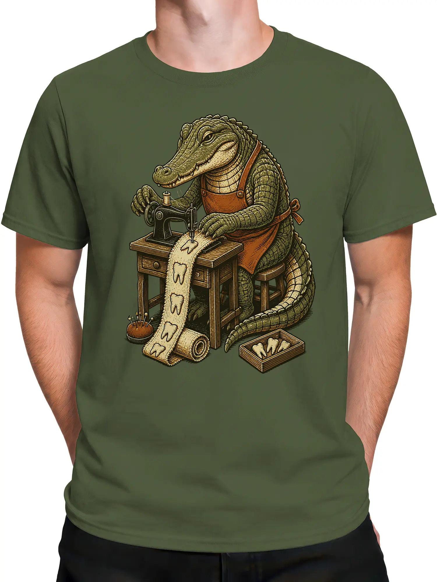 Male torso wearing a green T-shirt with a crocodile tailor and sewing machine graphic