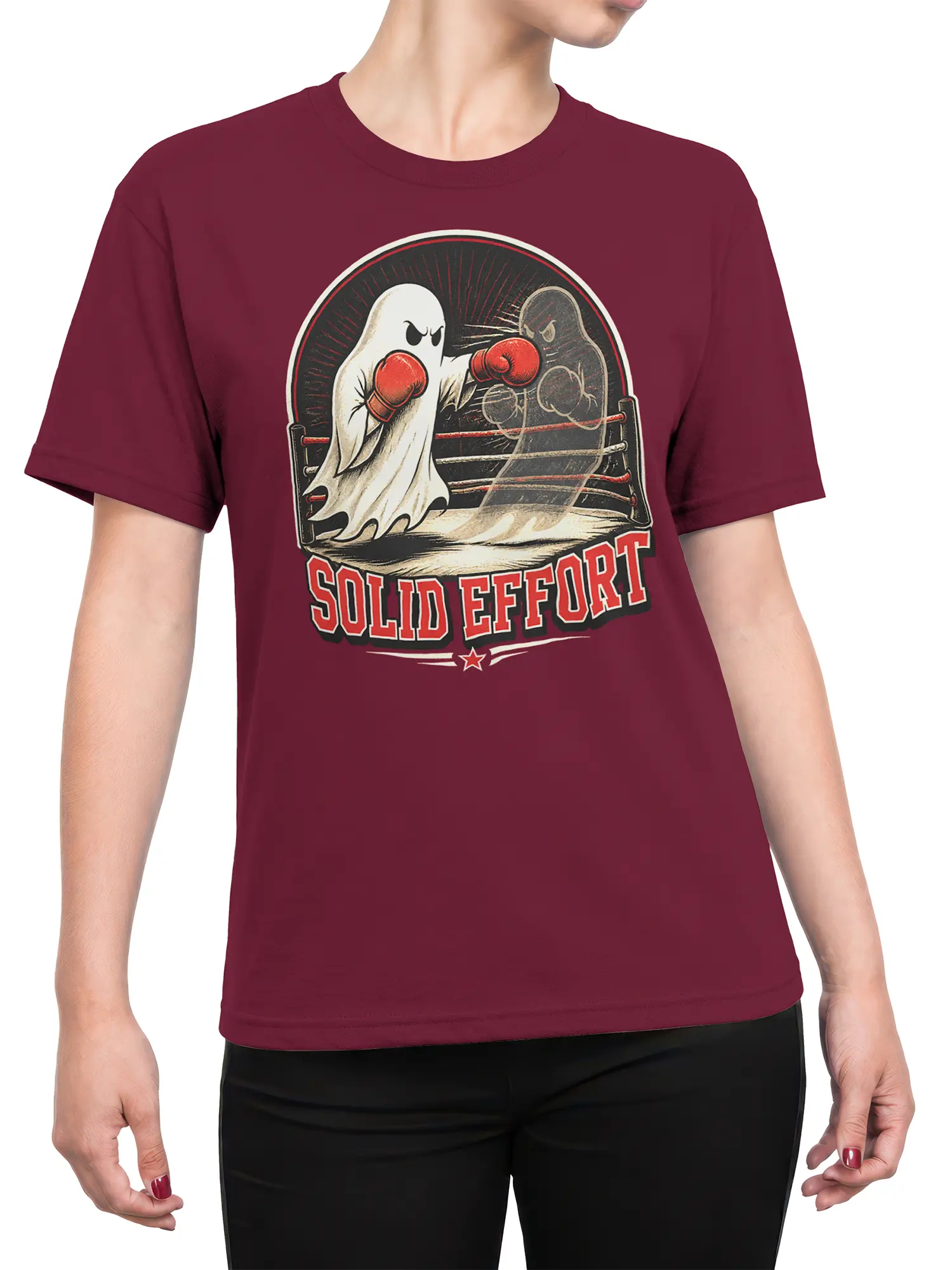 Female torso wearing a burgundy T-shirt with vintage ghost boxing artwork and “SOLID EFFORT” lettering