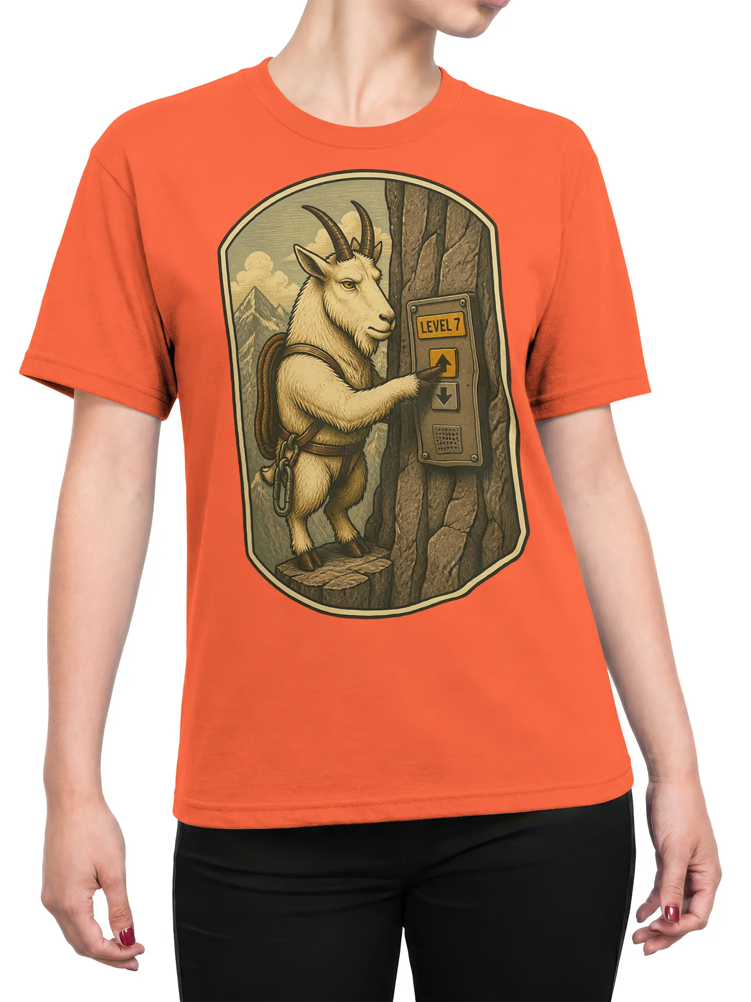Female torso wearing an orange mountain goat Level 7 graphic T-shirt