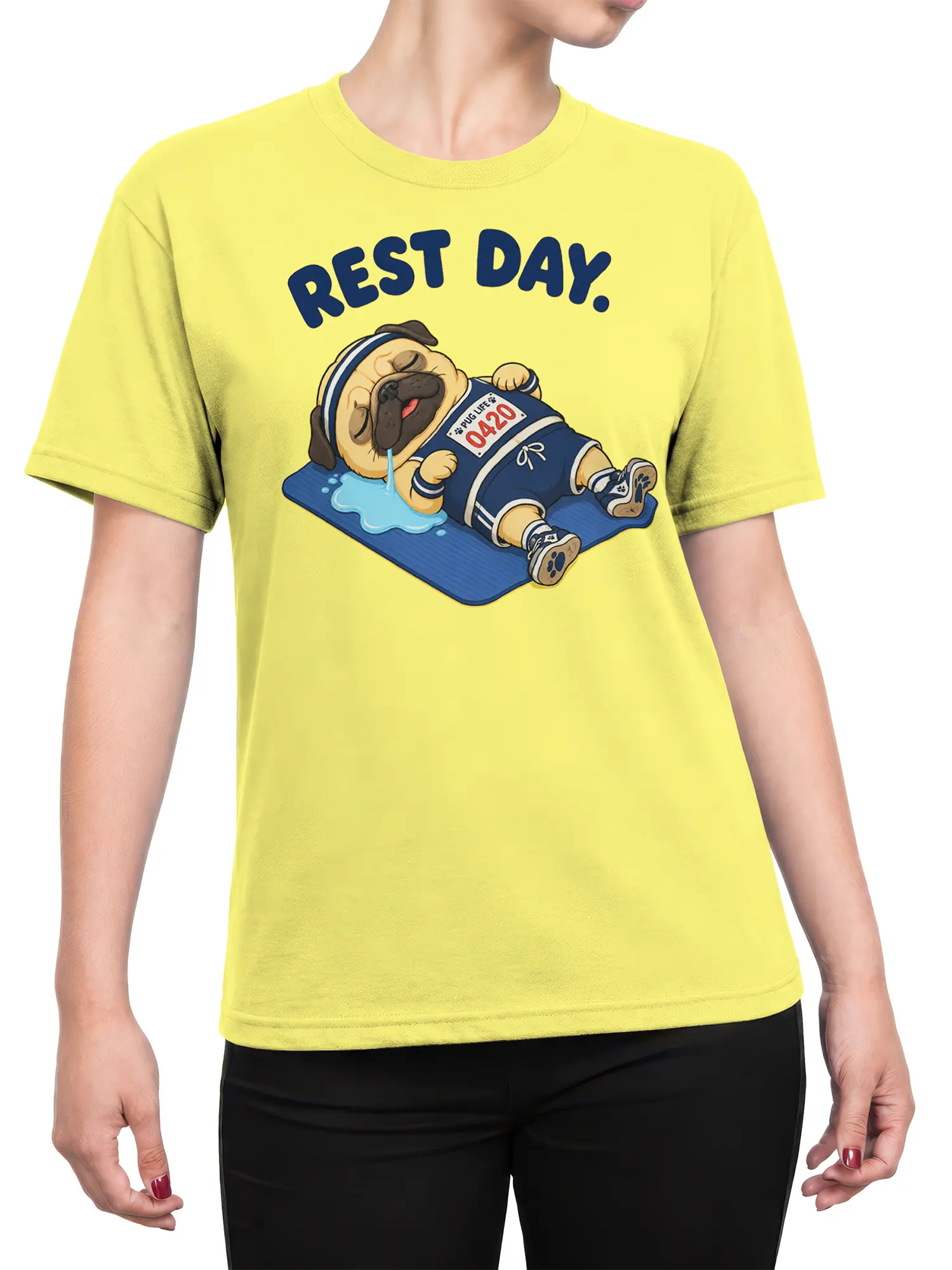 Female torso wearing a yellow pug graphic T-shirt with “REST DAY.” text and a sleepy dog on a blue mat