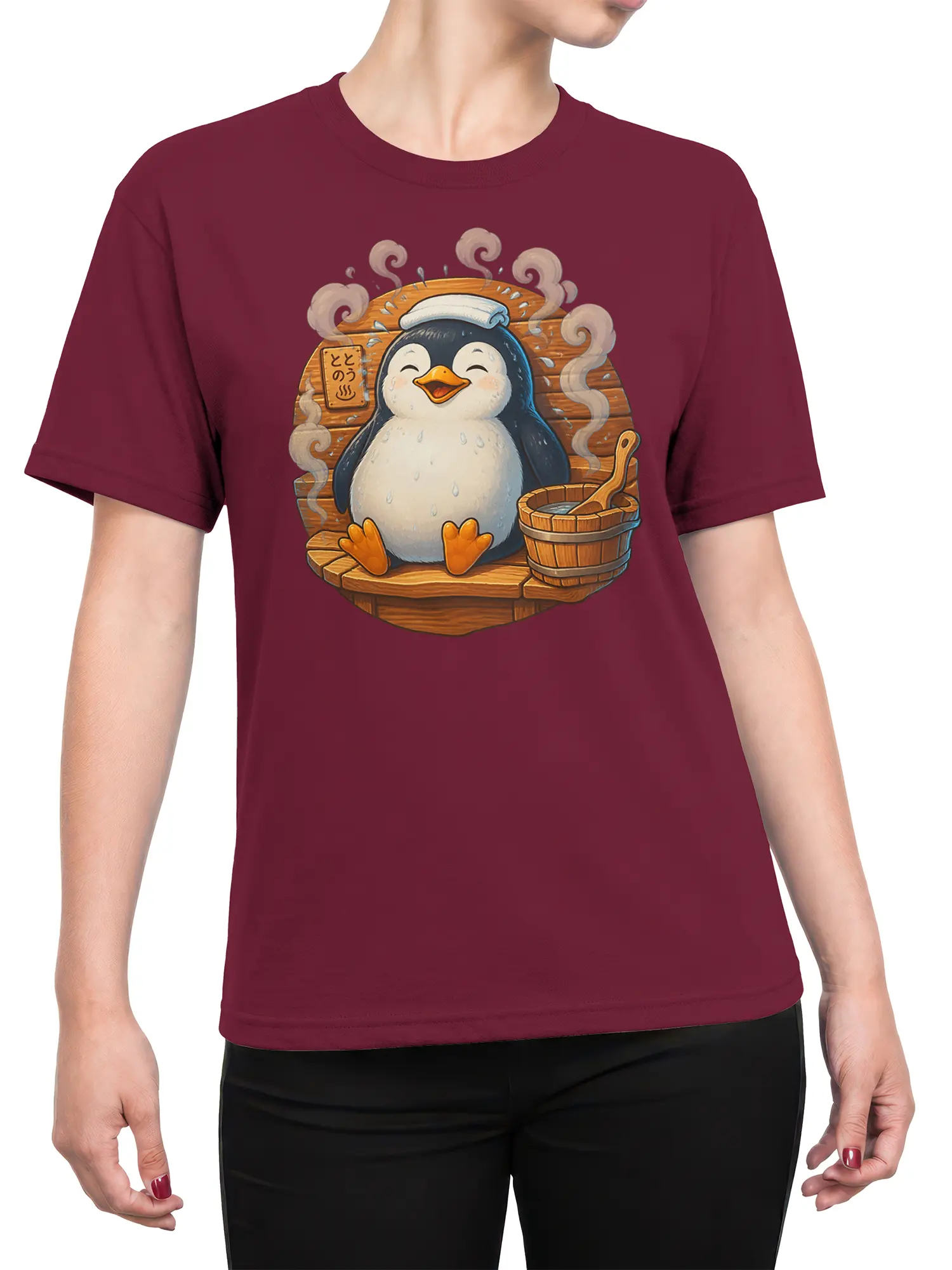 Female torso wearing a burgundy T-shirt with a cheerful penguin sauna graphic and steaming wooden bath scene