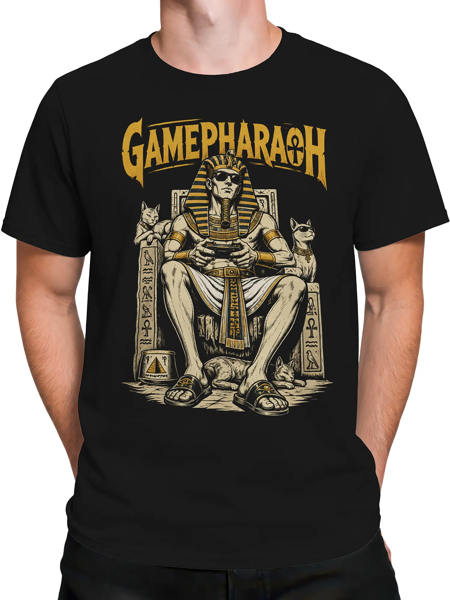 Male torso wearing a black Egyptian-inspired gaming T-shirt with a pharaoh, cats, controller, and gold artwork