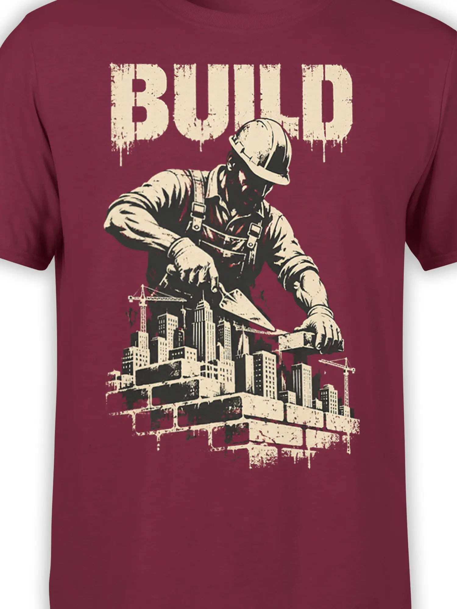 Close-up of construction worker, cranes, skyline buildings, and distressed BUILD graphic on burgundy fabric