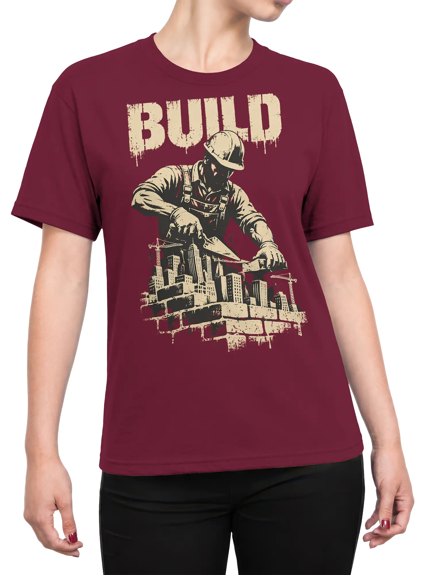 Female torso wearing a burgundy construction t-shirt with worker, cranes, skyline, and BUILD graphic