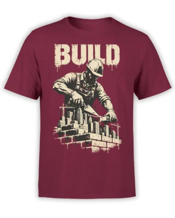 Burgundy construction t-shirt with hard-hat worker, cranes, skyline buildings, and distressed BUILD lettering