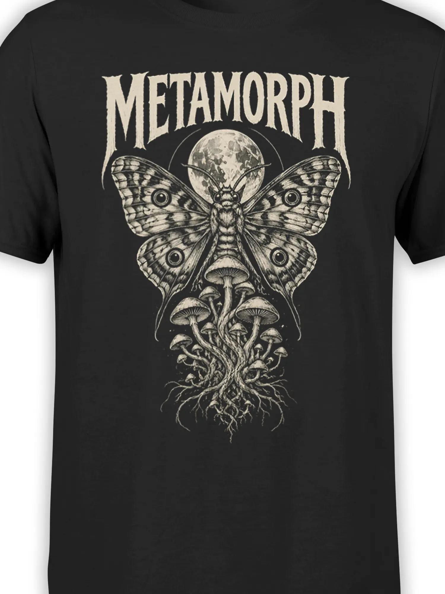 Close-up of cream moth wings, moon, and mushroom artwork on a black graphic T-shirt
