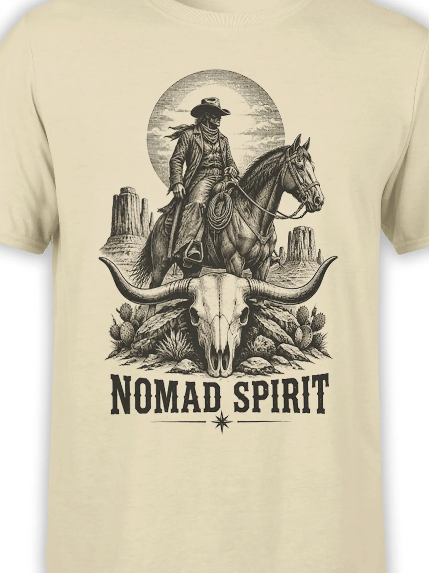 Close-up of cowboy, horse, desert skull, cactus, and Nomad Spirit artwork on beige western shirt