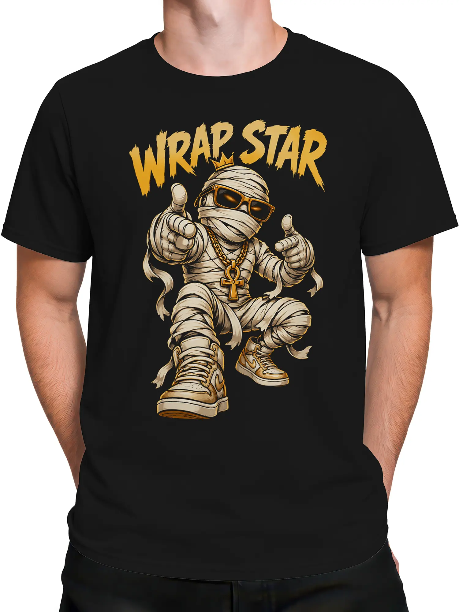 Male torso wearing a black mummy graphic T-shirt with crown, sunglasses, gold chains, sneakers, and WRAP STAR text