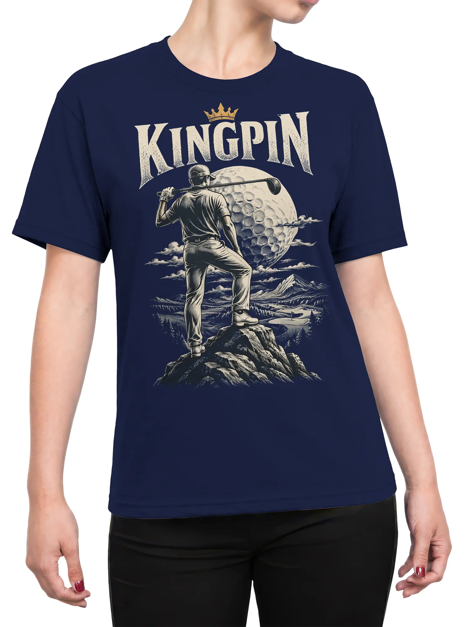 Female torso wearing a navy shirt with crowned golfer, giant golf ball, mountains, and KINGPIN artwork