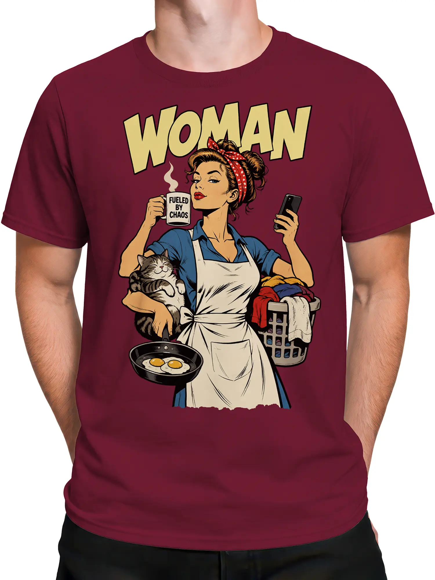 Male torso wearing a burgundy unisex graphic tee with a retro woman, cat, coffee mug, eggs, and chaos theme