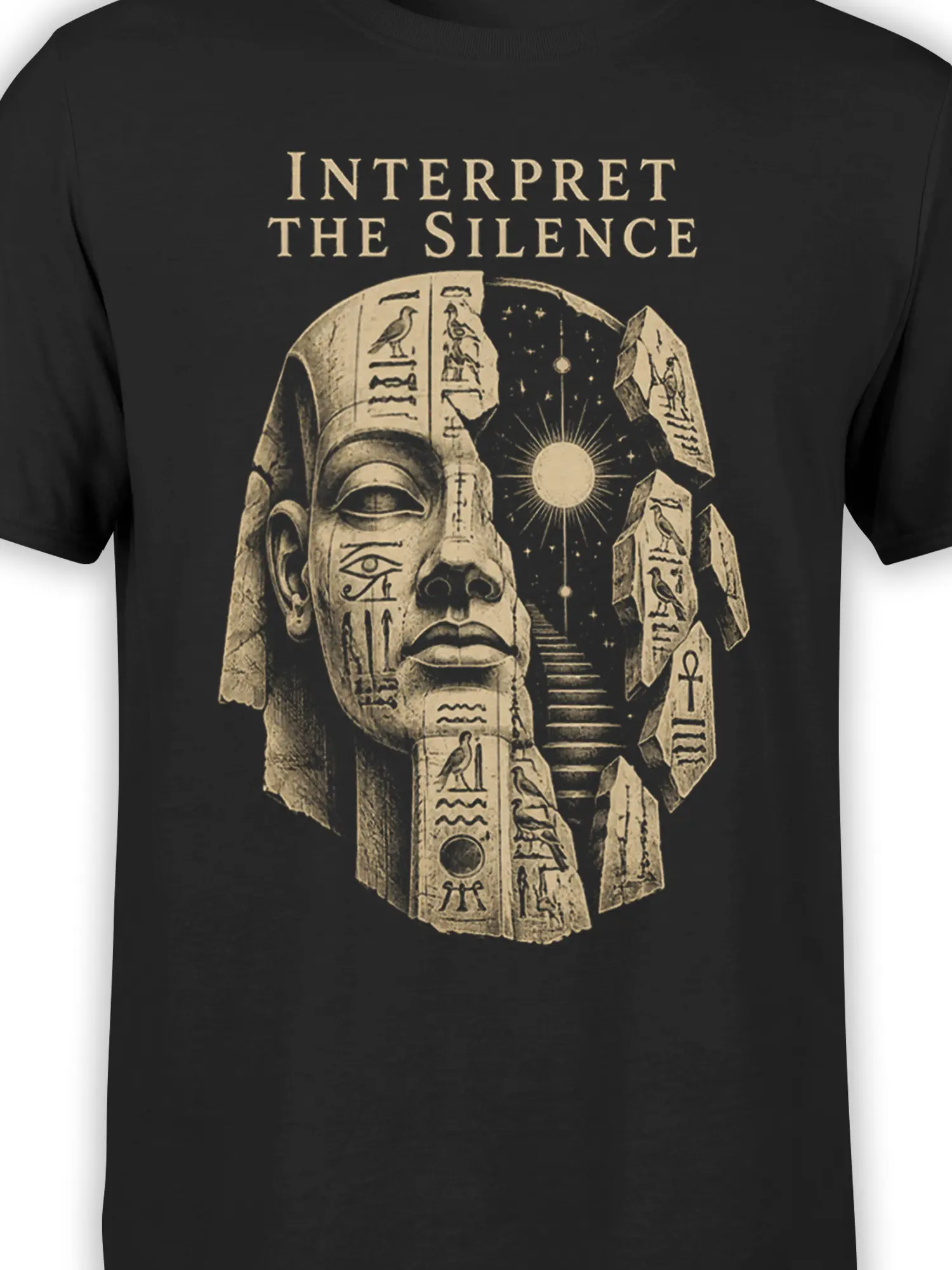 Close-up of the Egyptian pharaoh graphic, carved symbols, celestial sun, and stone details on a black shirt
