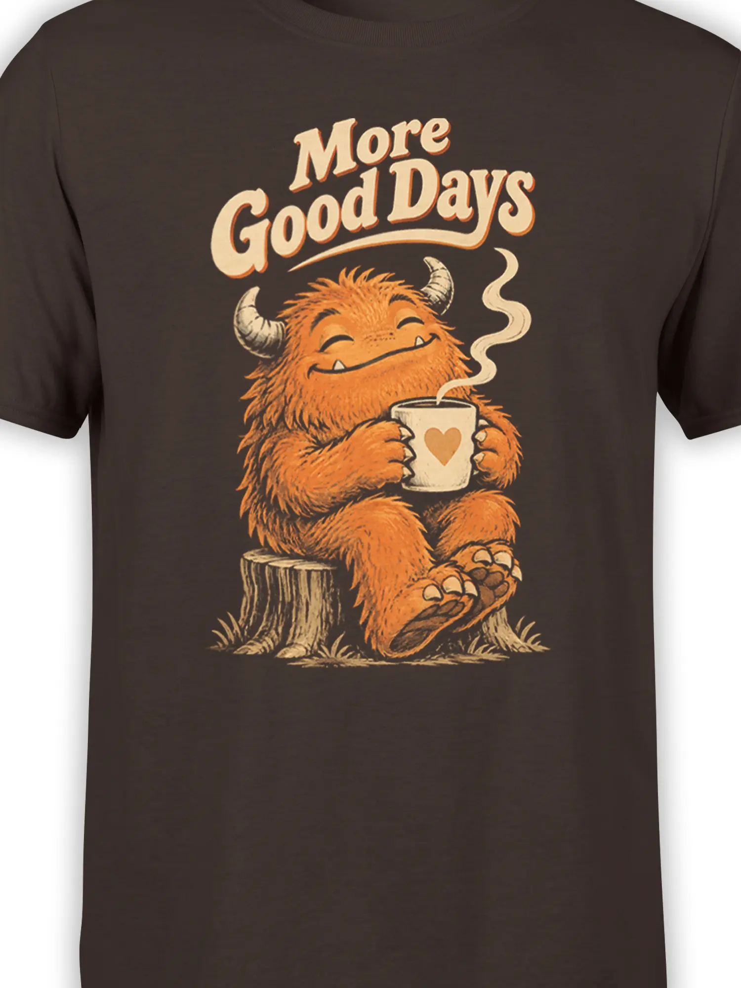 Close-up of orange horned monster holding a steaming heart mug on a dark brown graphic T-shirt
