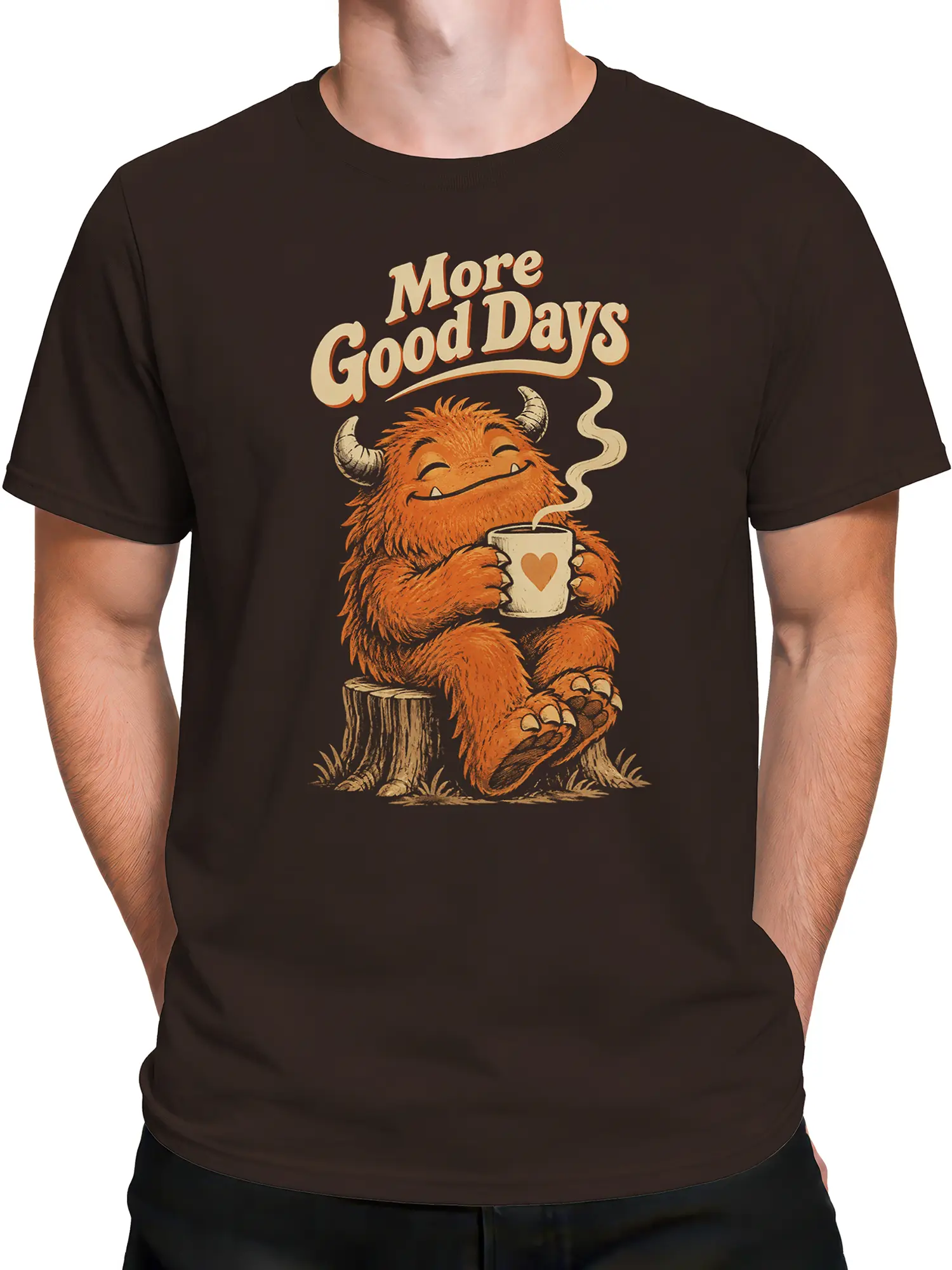 Male torso wearing a dark brown coffee T-shirt with an orange horned monster and heart mug