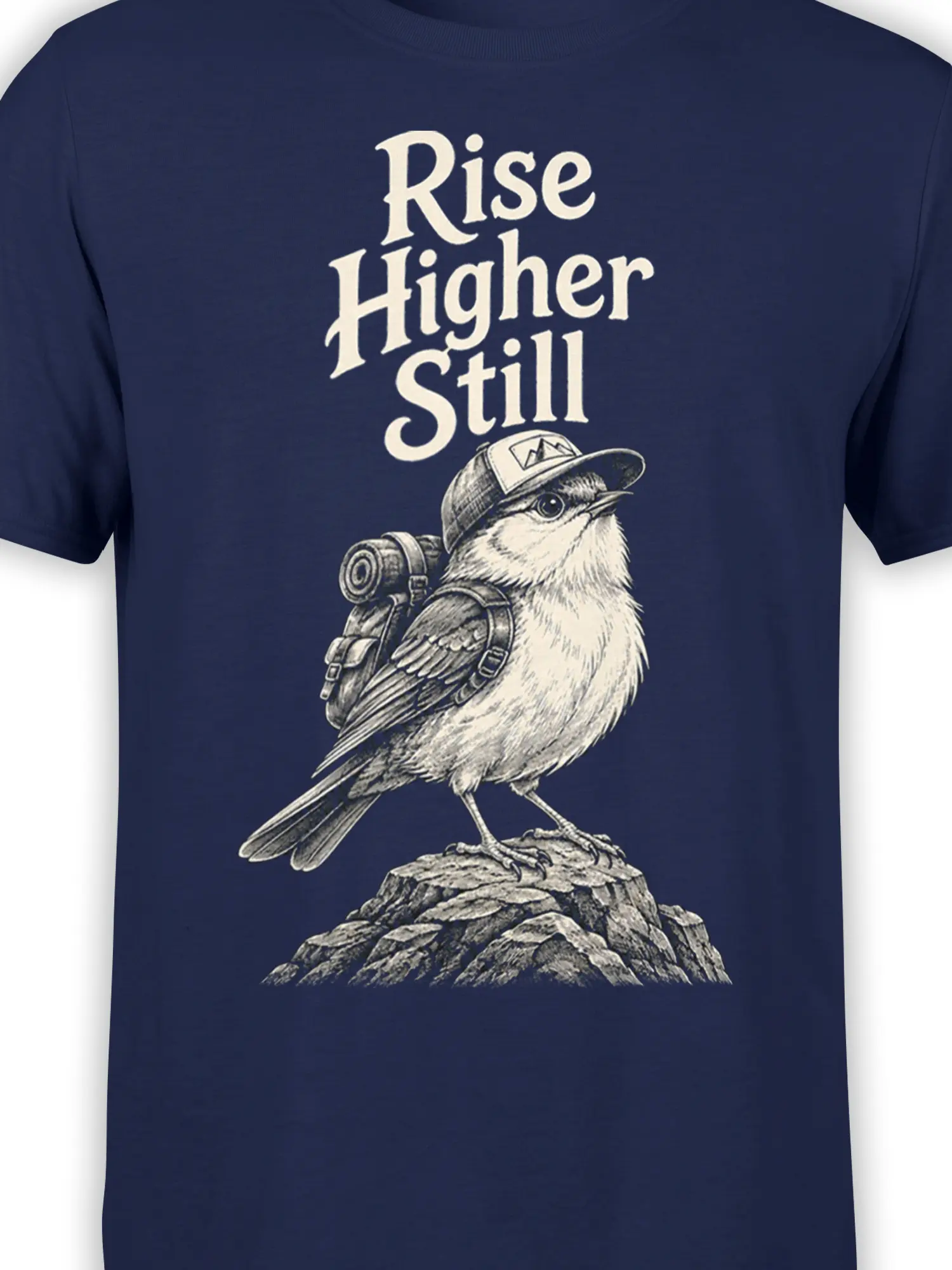 Close-up of the backpacked bird and Rise Higher Still lettering in cream on a navy graphic T-shirt