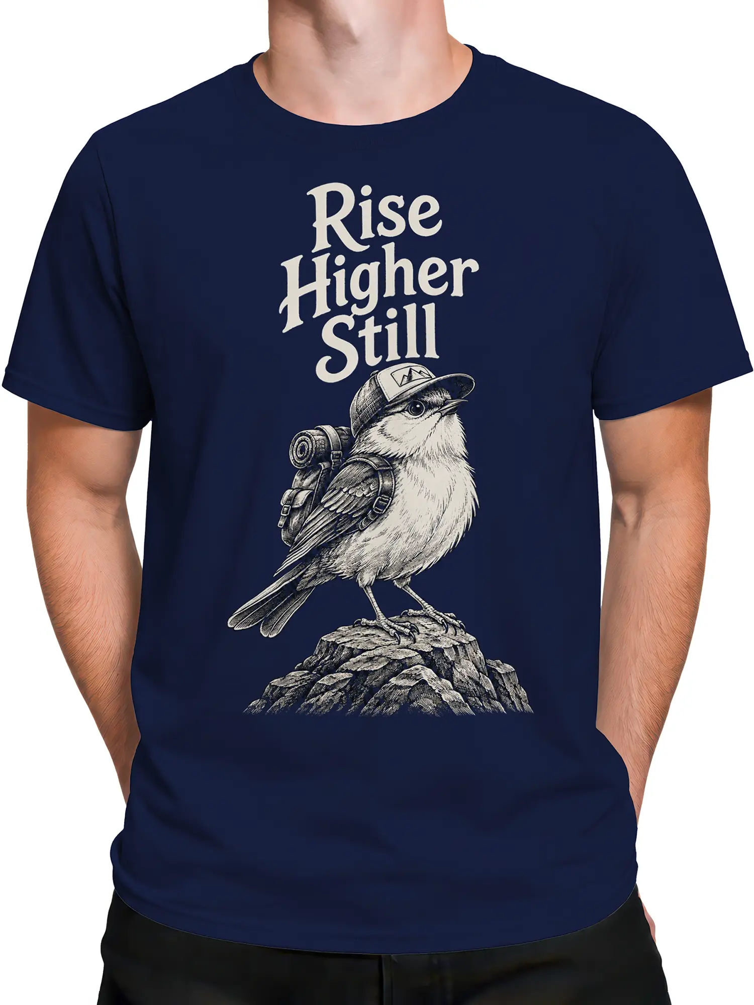 Male torso wearing a navy bird graphic T-shirt with a cap, backpack, rocks, and cream text