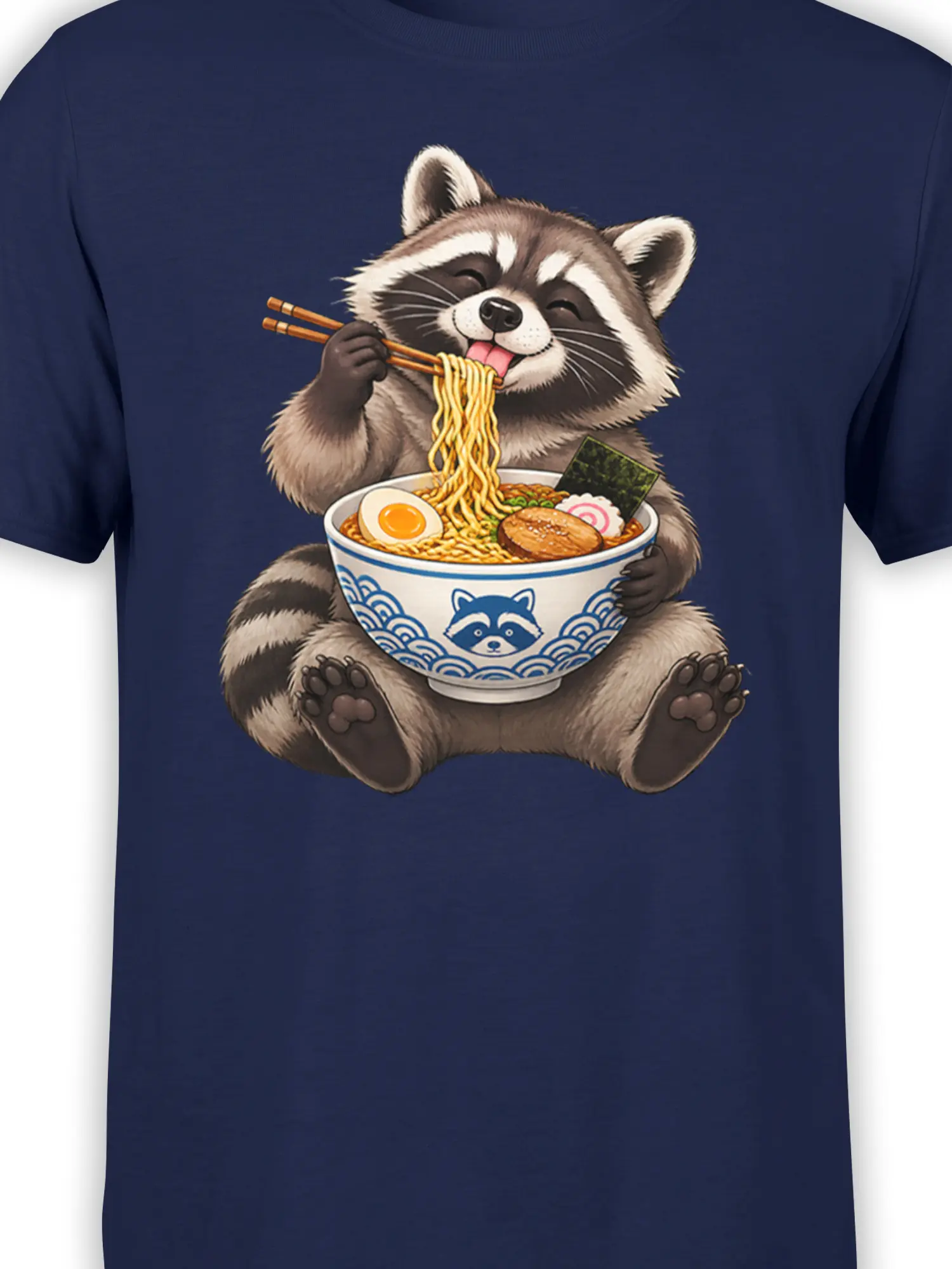 Detailed raccoon noodle artwork with chopsticks, egg, and toppings on a navy shirt
