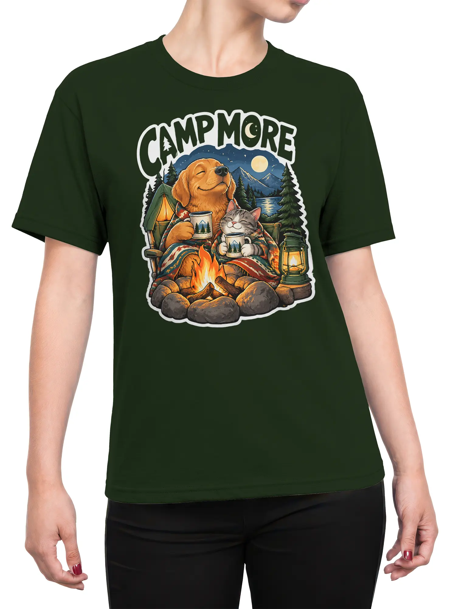 Female torso wearing a green camping T-shirt with dog, cat, campfire, tent, and CAMP MORE artwork
