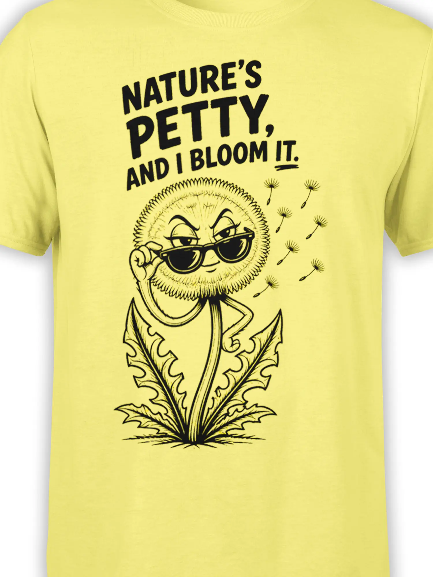 Close-up of a sarcastic sunglasses-wearing dandelion graphic and black lettering on a yellow T-shirt
