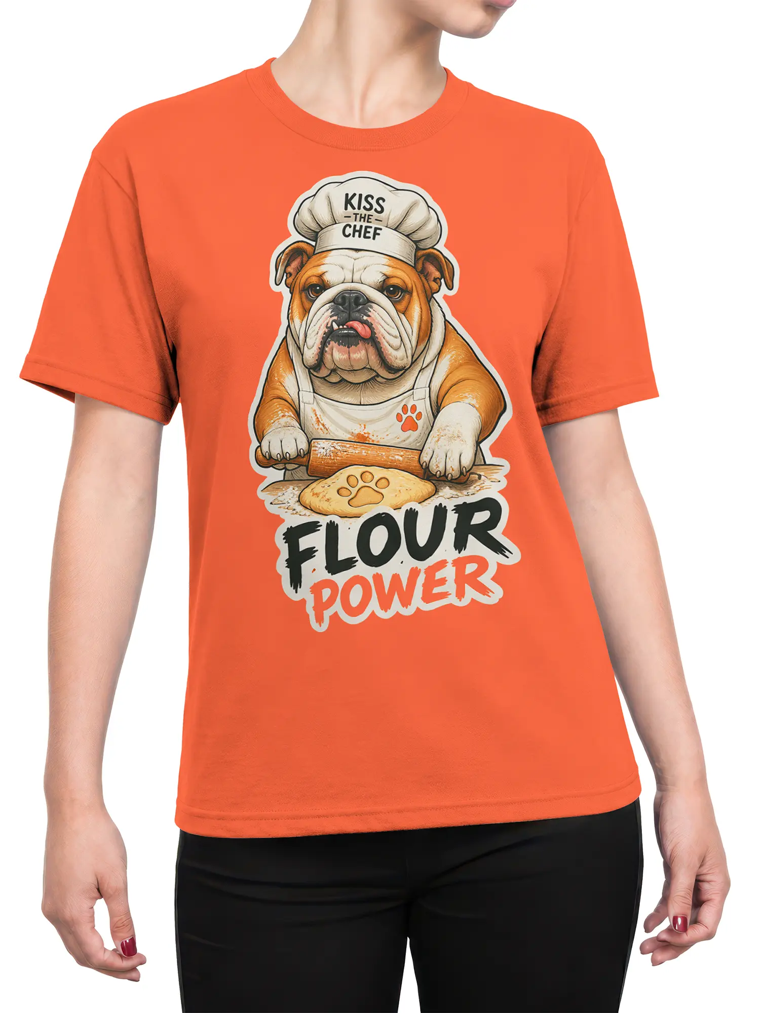 Female torso wearing an orange T-shirt with a bulldog chef, rolling pin, and Flour Power graphic