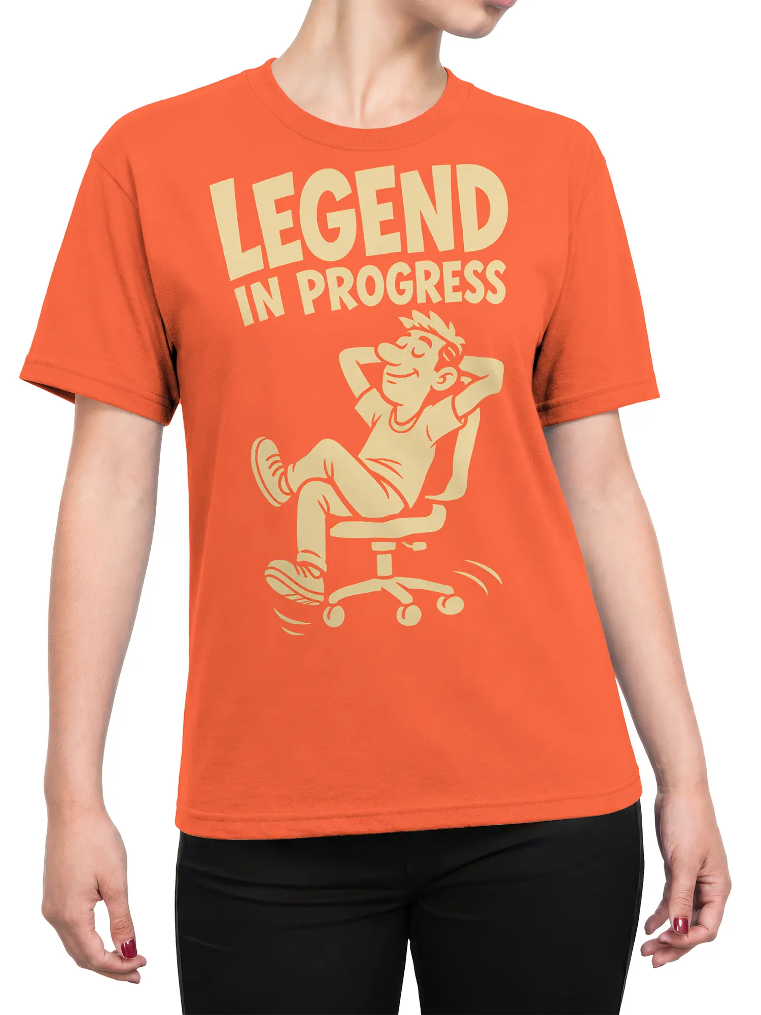 Female torso wearing an orange T-shirt with a relaxed office worker graphic and “LEGEND IN PROGRESS” text