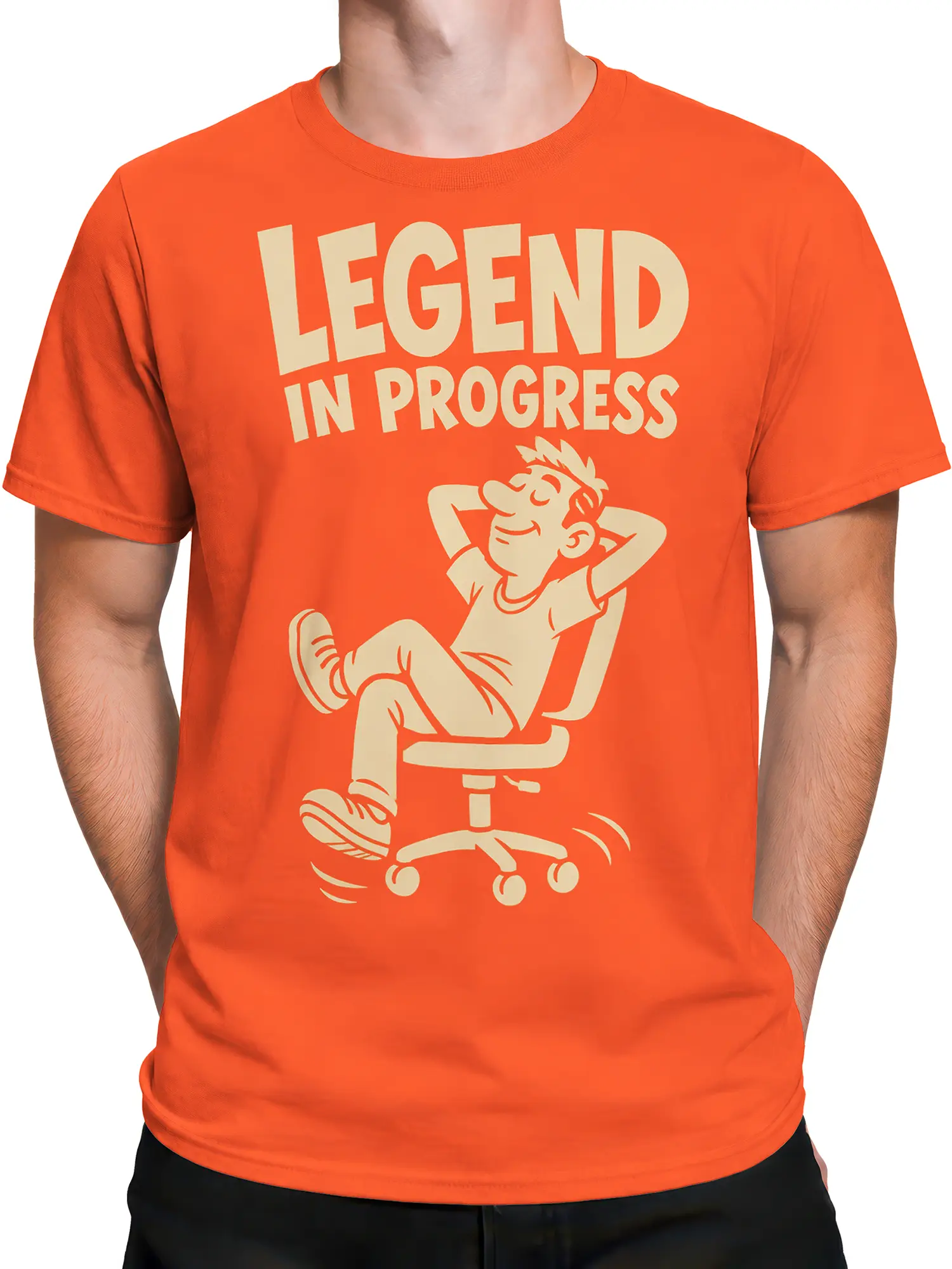 Male torso wearing an orange T-shirt with a reclining cartoon worker and “LEGEND IN PROGRESS” design