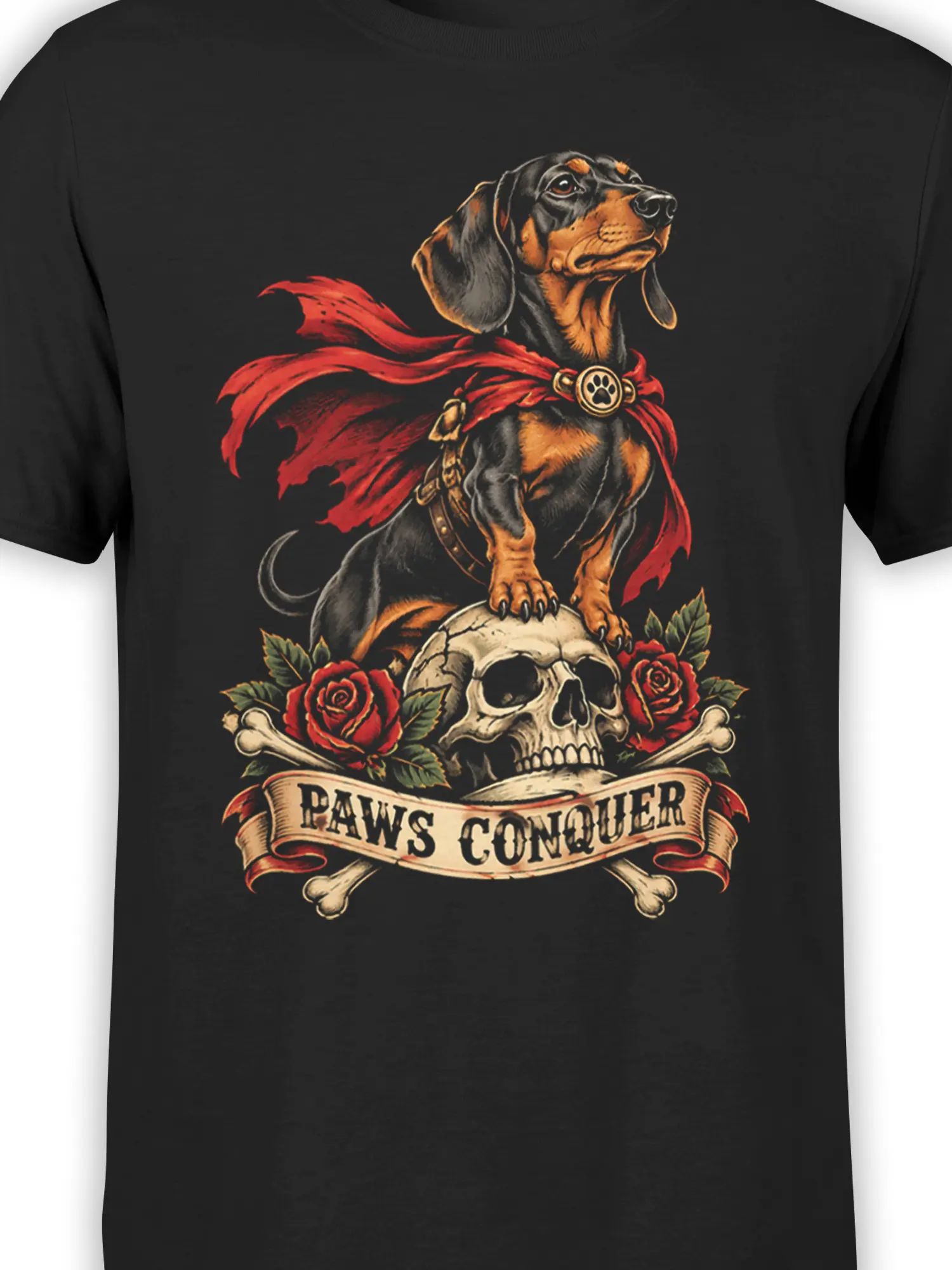 Close-up of the black T-shirt design showing a caped dog, paw emblem, skull, roses, and PAWS CONQUER banner