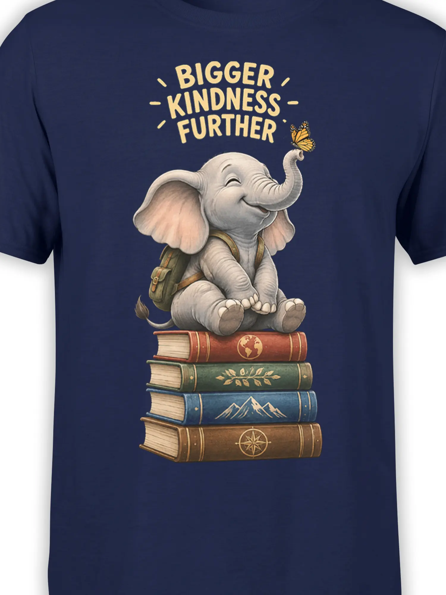 Close-up of navy elephant graphic tee showing books, backpack, butterfly, and kindness lettering