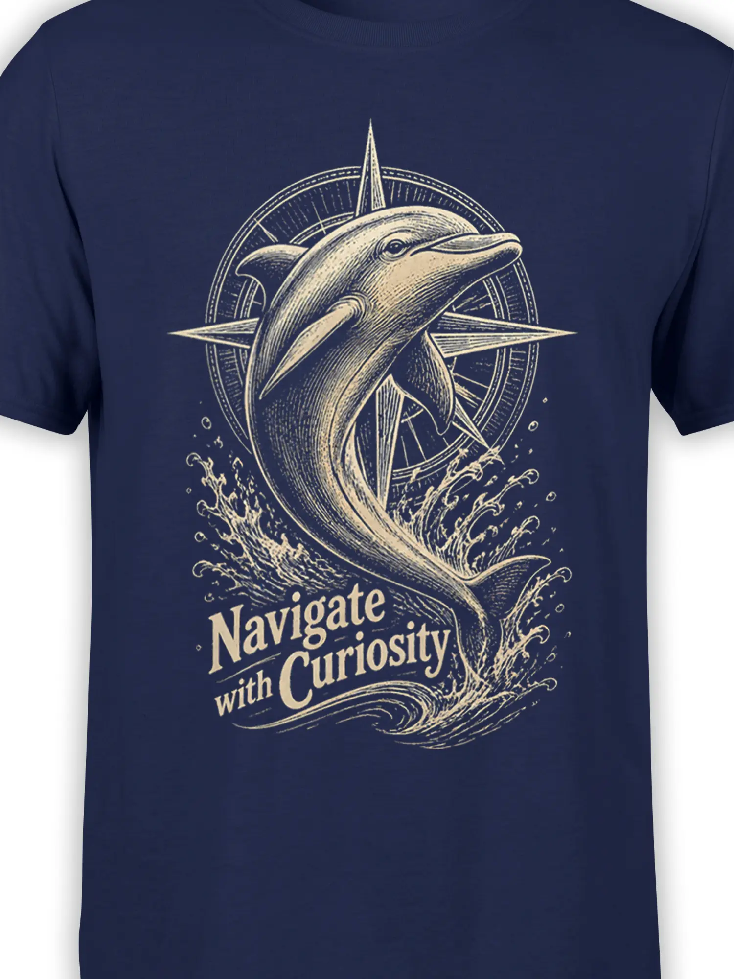 Close-up of cream dolphin, compass rose, waves, and curiosity slogan on a navy graphic T-shirt