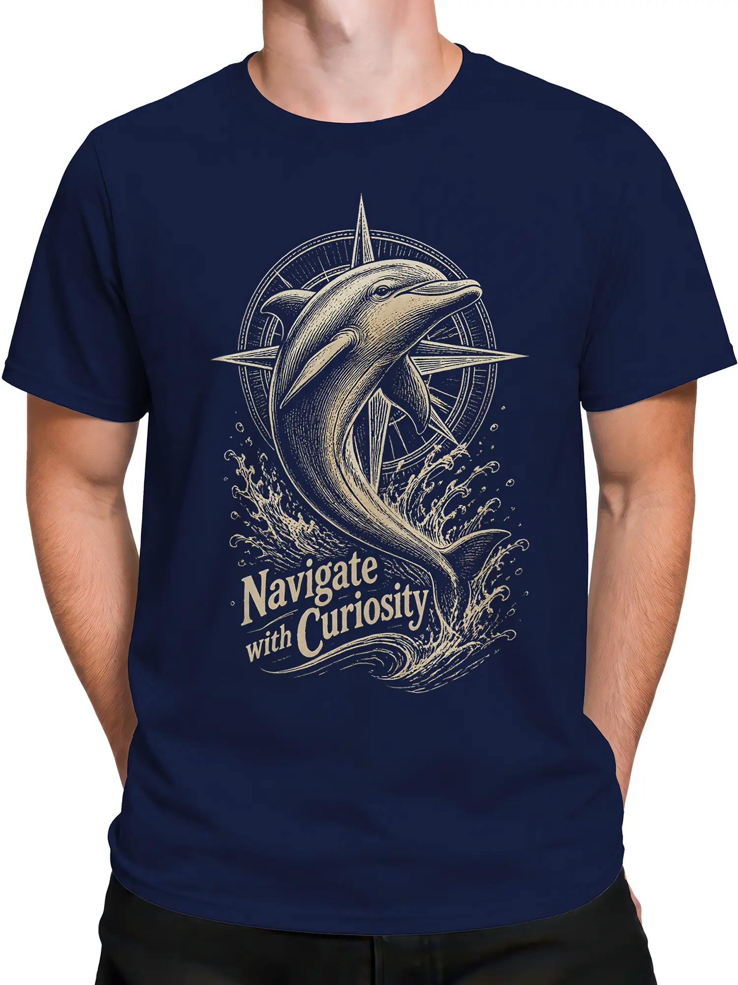 Male torso wearing a navy dolphin T-shirt with vintage compass, ocean wave, and curiosity artwork