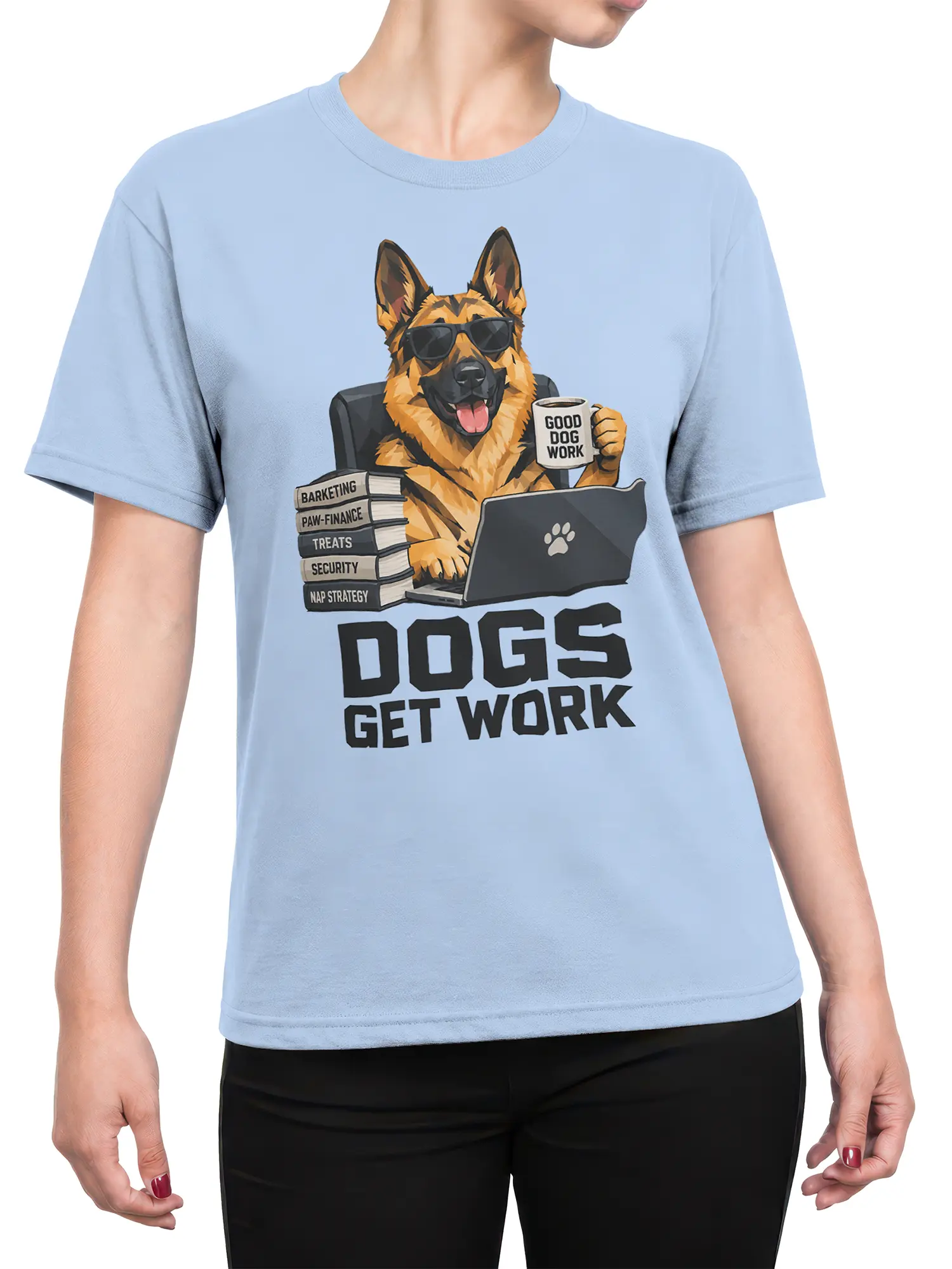 Female torso wearing a light blue German Shepherd office dog shirt with laptop, coffee, books, and bold graphic text