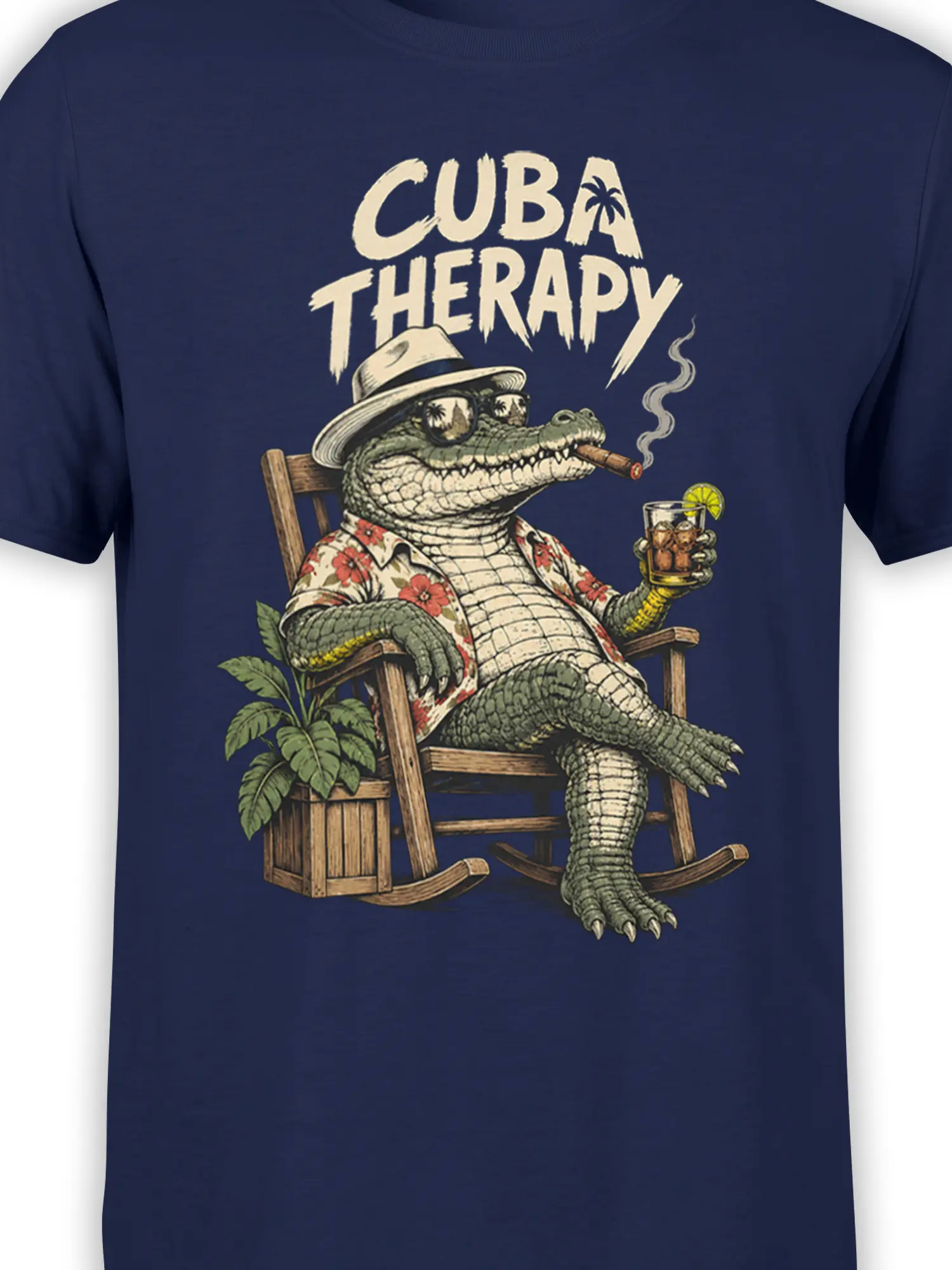 Close-up of the Cuba Therapy crocodile design on navy fabric with tropical details and vintage lettering