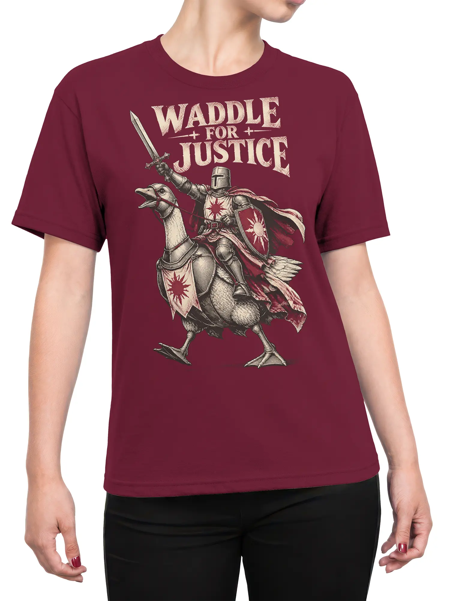Female torso wearing a burgundy T-shirt with an armored goose knight and “Waddle for Justice” design