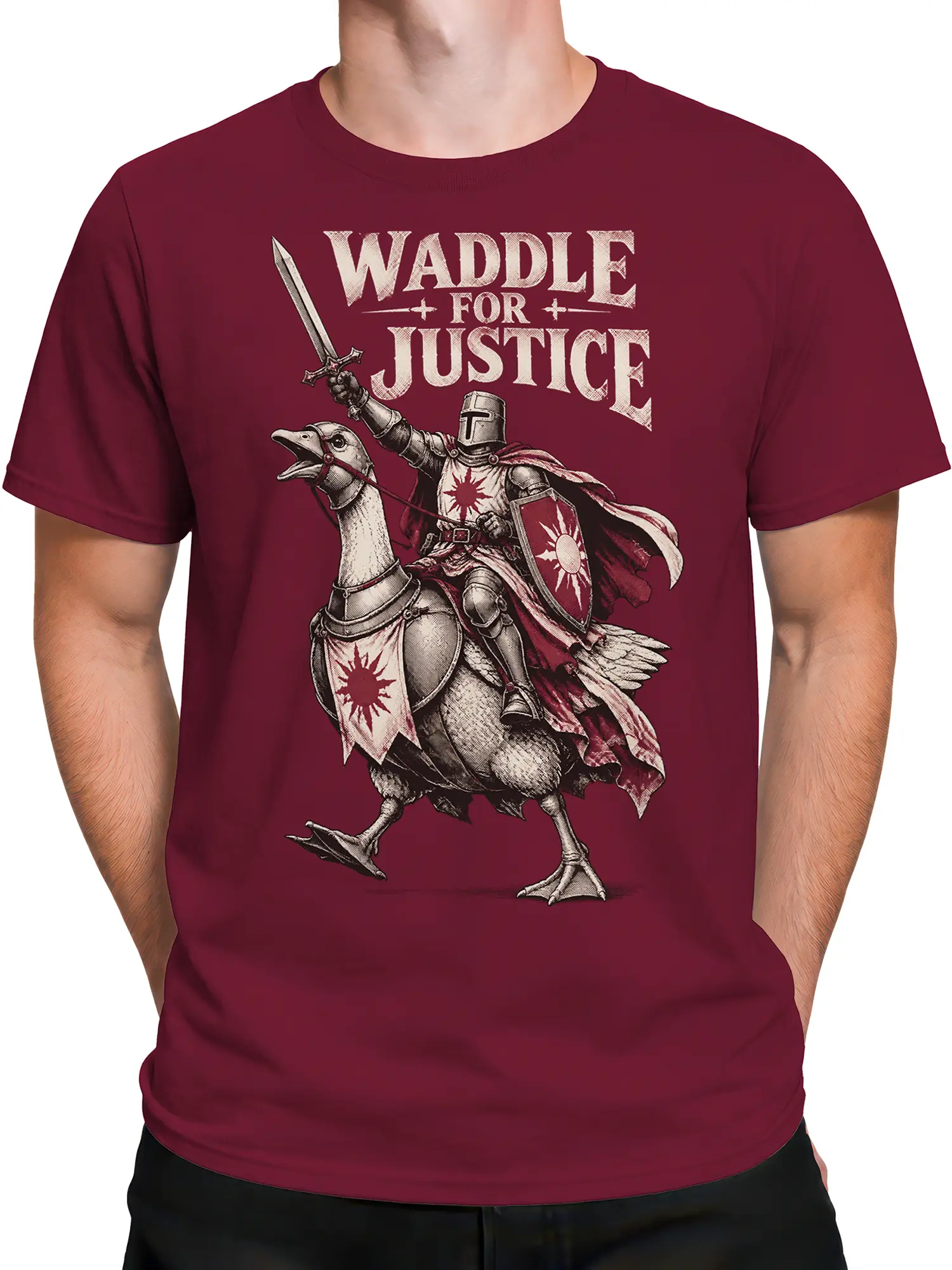 Male torso wearing a burgundy goose knight T-shirt with sword, shield, and justice artwork