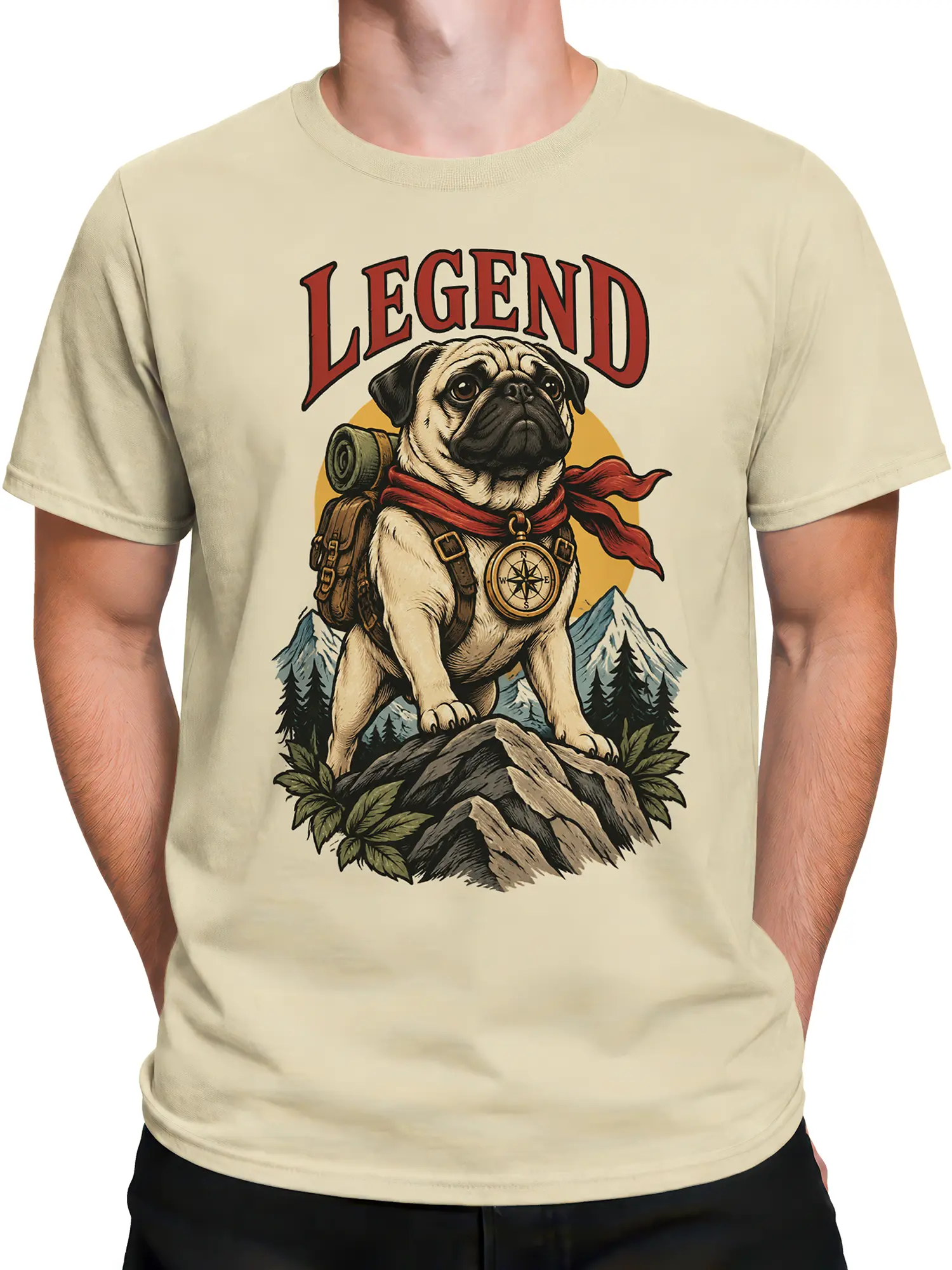 Male torso wearing a beige vintage pug T-shirt with a backpack, compass, scarf, and mountain design