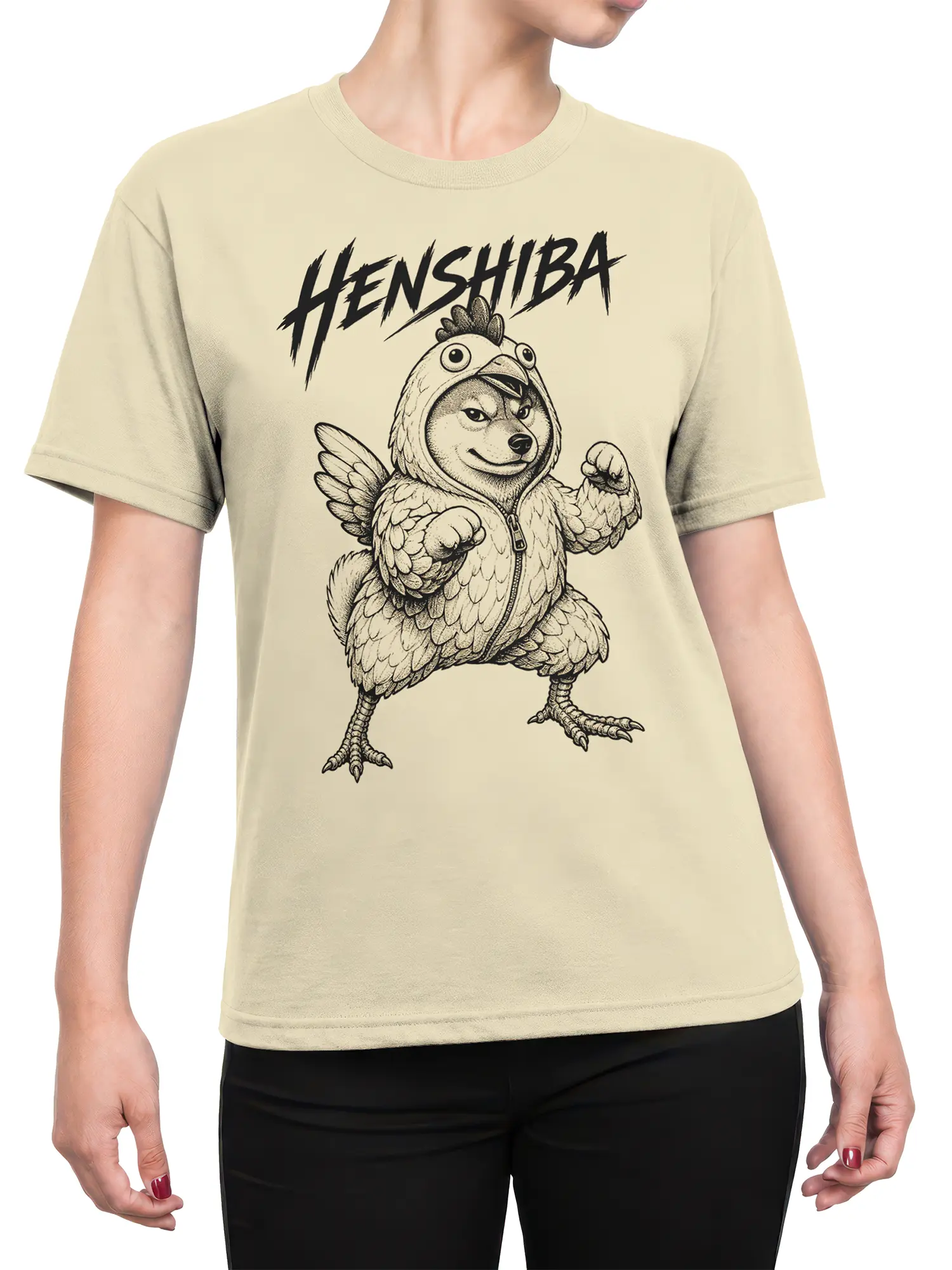 Female torso wearing a beige Henshiba chicken dog T-shirt with a winged character and bold black lettering