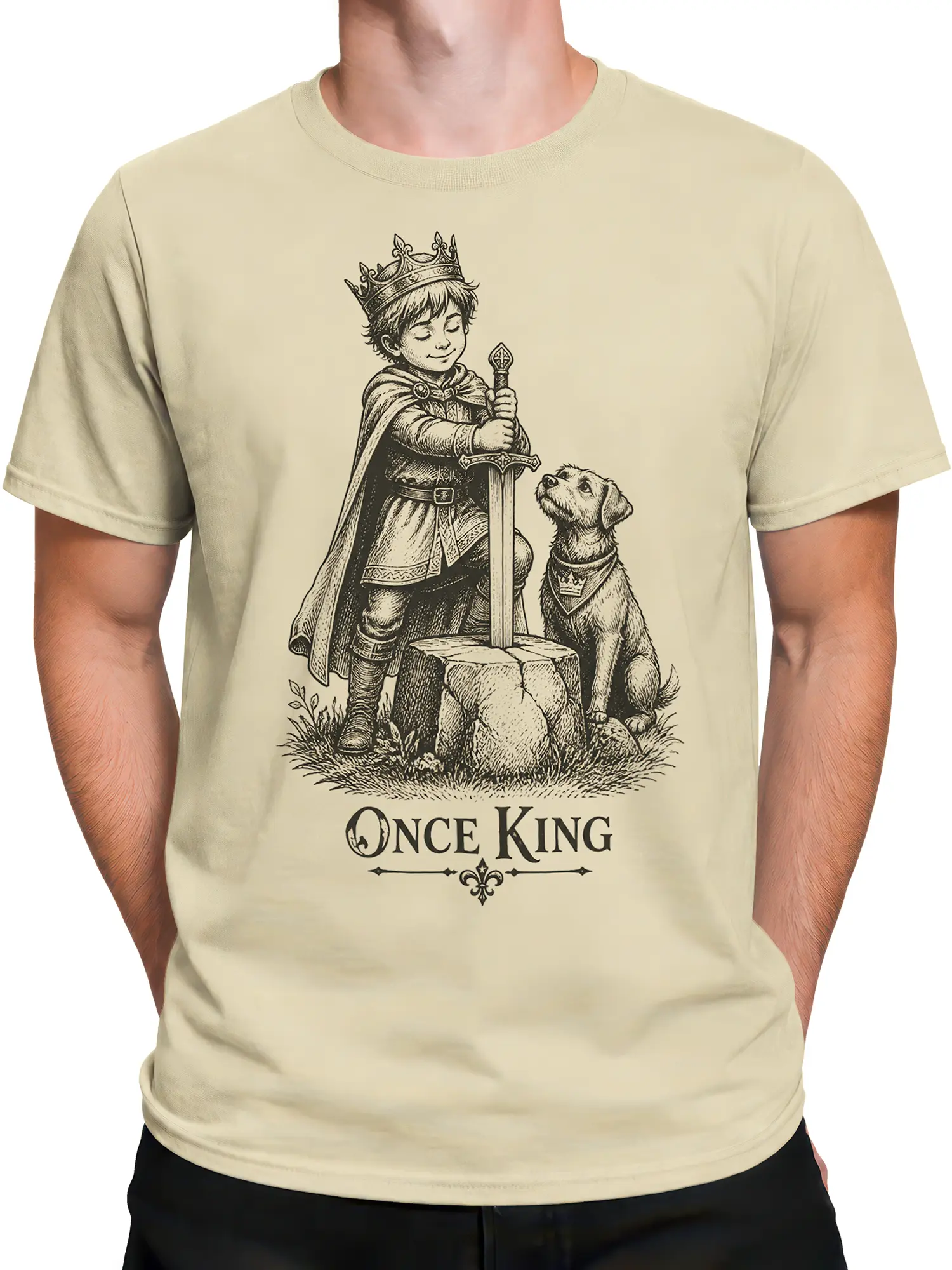 Male torso wearing a beige fantasy dog tee with a young king, sword, and royal dog design