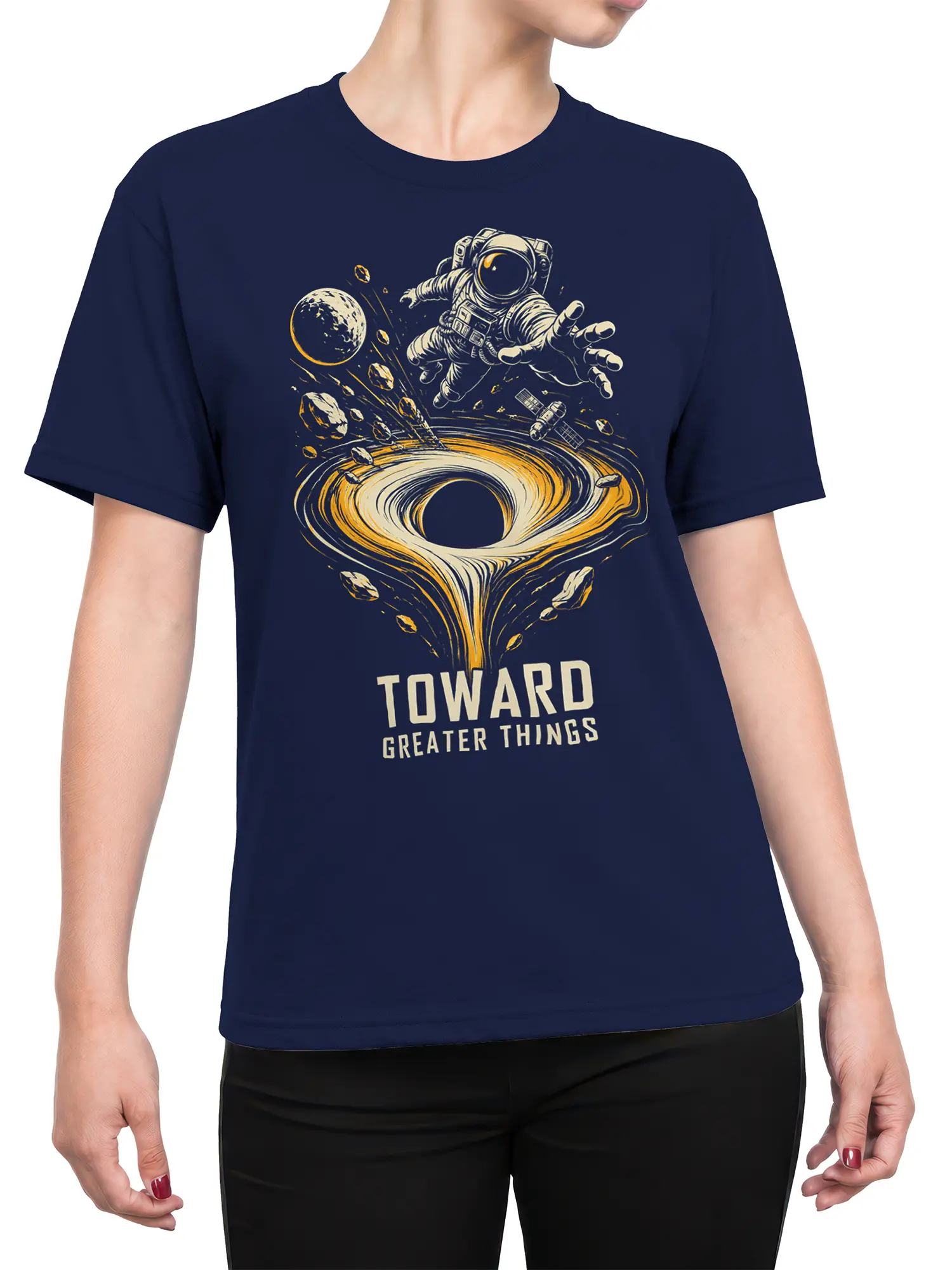 Female torso wearing navy astronaut T-shirt with black hole, planet, satellite, and “Toward Greater Things” design
