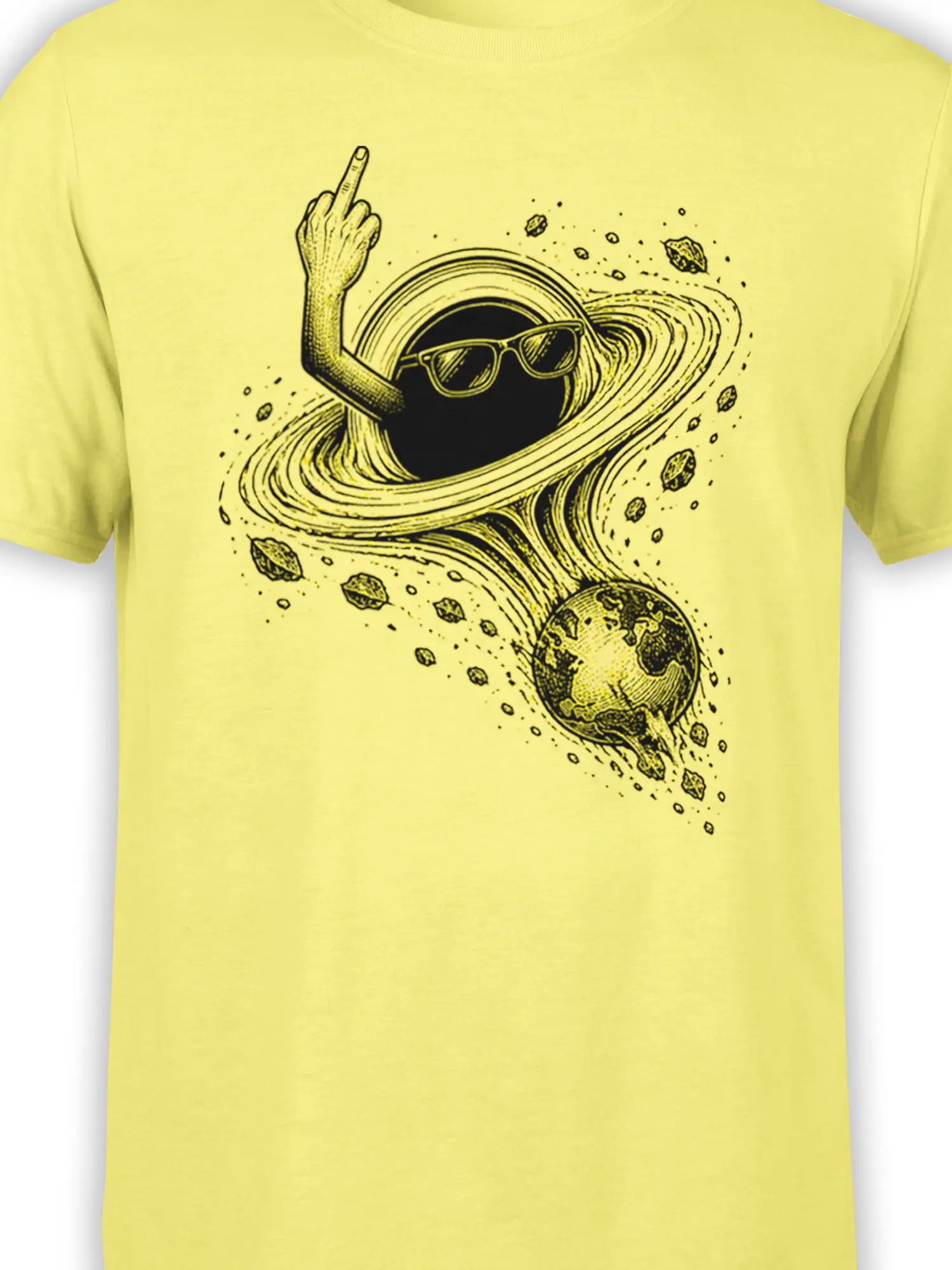 Close-up of the black ringed planet and sunglasses artwork printed on a yellow space T-shirt