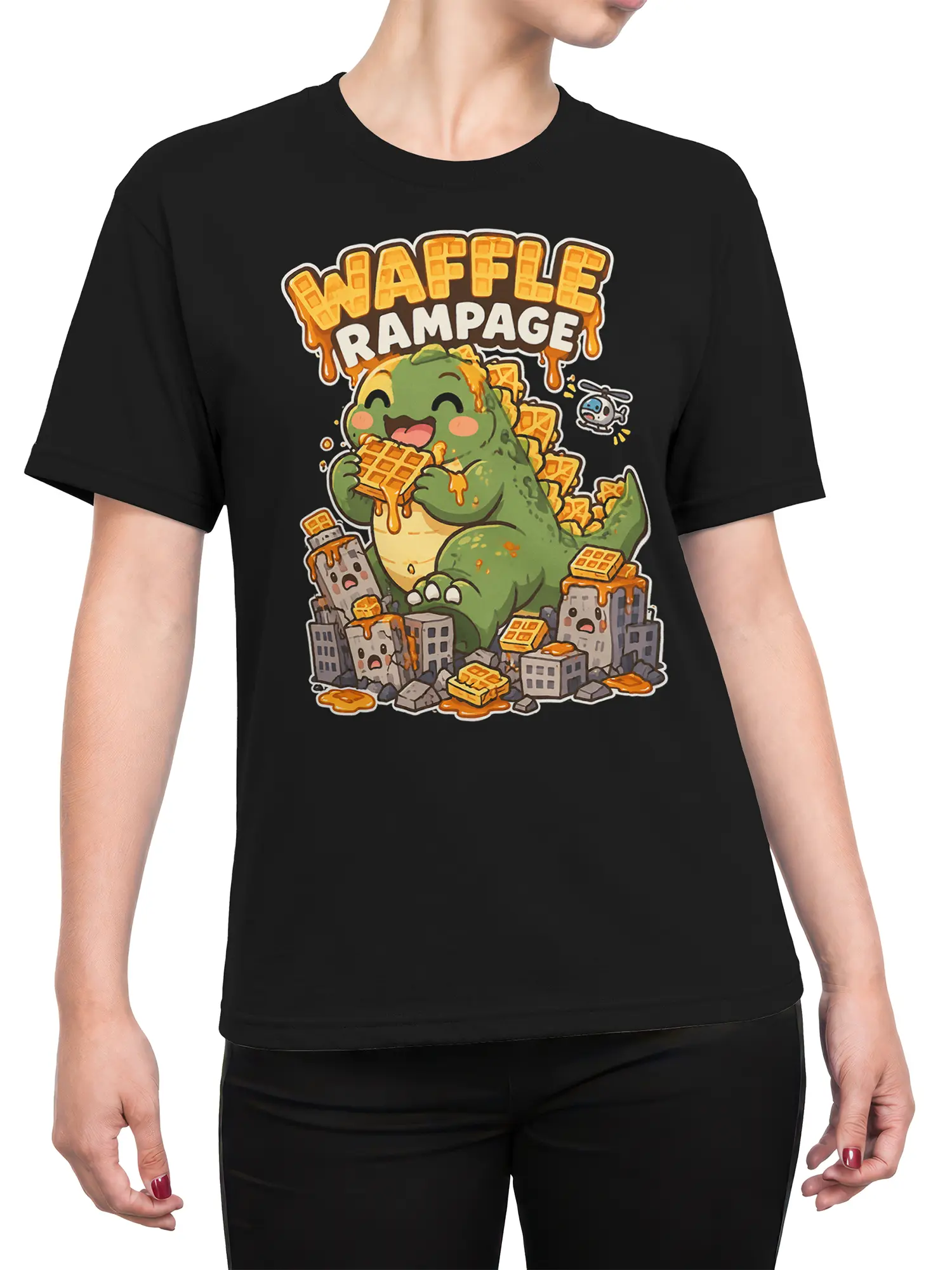 Female torso wearing a black Waffle Rampage T-shirt with a green dinosaur, waffles, syrup, and city artwork